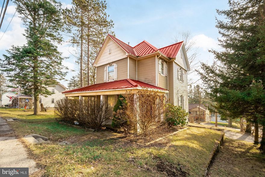 3/4BR, 2.5 BA two-story home has been lovingly renovated & modernized inside and out! Vinyl siding & metal roof, high-end finishes in bathrooms & hardware upgrades. Recently added 100 amp electrical service, hot water tank, and wall heater in garage. Multiple living areas to entertain guests & eat-in kitchen with custom cabinets & potential breakfast nook. Original craftsman style woodworking & trim. Walking distance to most town amenities. 1 car att. garage. Wraparound porch (covered in front), back deck. Mature trees, corner lot.