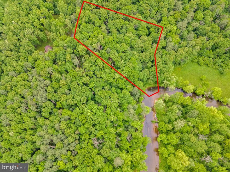 Unique opportunity to own a beautiful 4.5 acre building lot with Hazel River frontage in quiet subdivision near Boston and Culpeper VA  Great access to US 522 and US 29 .   Convenient level to gently sloping building site with some winter views of the river.  Wooded with nice walk to the river.  The Hazel river is one of Virginias most scenic waterways cutting its way from the Blue Ridge Mountains through fertile farmland and serene forests. The land has frontage on Deer Lane with easy access to a home site.  This parcel is near the end of Deer Lane and starts just past the last home on the left.