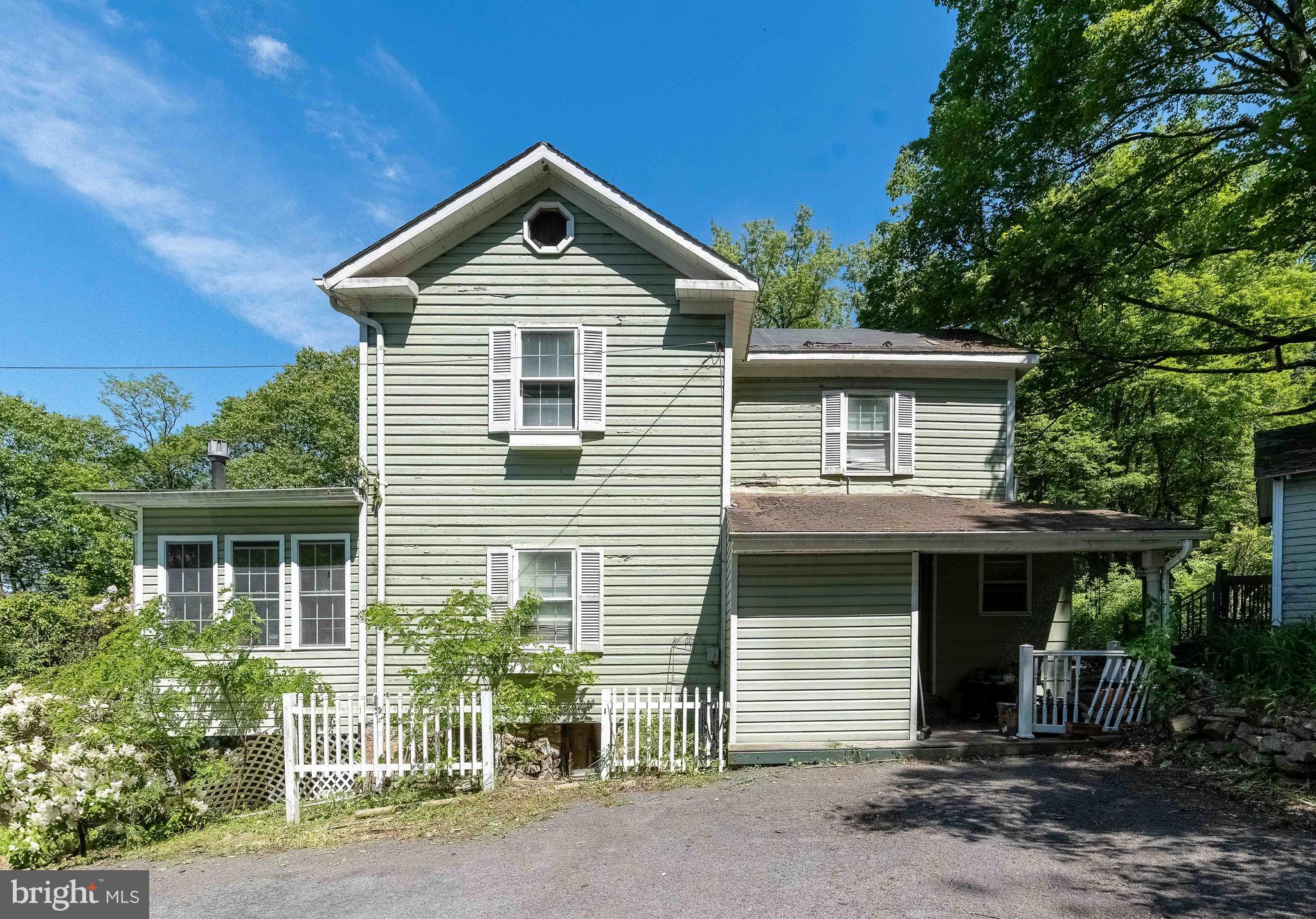 Discover the charm and potential of this classic 4-bedroom farmhouse nestled on 1.7 picturesque acres nestled between LaVale and Frostburg. With a peaceful rural setting yet just minutes from town conveniences, this property offers the best of both worlds. The home features a first-floor bedroom, making it ideal for multigenerational living or added convenience. The layout includes a spacious living area, a bright kitchen ready for your updates, and plenty of natural light throughout. Outdoors, enjoy wide-open space perfect for gardening, animals, or simply soaking in the mountain views. At this price this house won't last long.