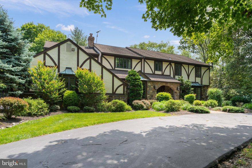 This spectacular custom Tudor home is situated on a beautifully landscaped one-acre lot with heated pool. Boasting upgrades and remodels almost too myriad to mention, this home has it all.  Enter from a circular driveway to a formal foyer with marble flooring . Custom-designed double door entry enclosure with leaded glass doors and side panels. 
All of the first floor beside the foyer and office boasts Brazilian cherry floors. Living room with stunning fireplace mantle, gas fireplace, and built-in bookcases surrounding. Family room with 2nd gas fireplace and full wet bar, triple doors to Florida Room which overlooks the pool and yard. There is an additional full bath and office (bamboo flooring) on the first floor.  There is a spectacular dining room, easily seating 15+ guests.  Hardwood flooring with incredible custom millwork, and vaulted coffered ceiling.  Simply gorgeous.  There is a custom-designed exit door to yard off the dining room which continues to the Tudor theme.  The kitchen is a gourmet's dream.  Multilevel island with seating.  Granite counters and huge Island. Subzero refrigerator, built-in microwave, three ovens, double sink, and second sink in island, warming drawer and a WOLF 6 burner stove with grill insert (propane). Amazing storage in walk-in pantry as well as a butlers pantry between kitchen and dining room 
 Must be seen to appreciate the detail.  All windows throughout are replaced.  Turned staircase to the second floor.  Four incredibly generous bedrooms and 2 baths. Closets galore including a sitting room.  Master bathroom with heated floors, double sink vanity, huge walking shower with 8 jet (car wash) shower and 6 foot bench.  Private door to toilet. Buildt-in bureau and cabinets Steeping tub with tv viewing. 
Basement with half bath, 
Egress window, new vinyl wood look flooring, reconfigured storage room.  
The yard is meticulously landscaped and has a shed for pool equipment.  Inground pool has been retiled and replastered and has propane heat as well as whirlpool spa.  Yard is fenced in with black aluminum fencing.  
This home is beautiful and has been diligently maintained and loved by present owner.  Professional photos next Tuesday published.