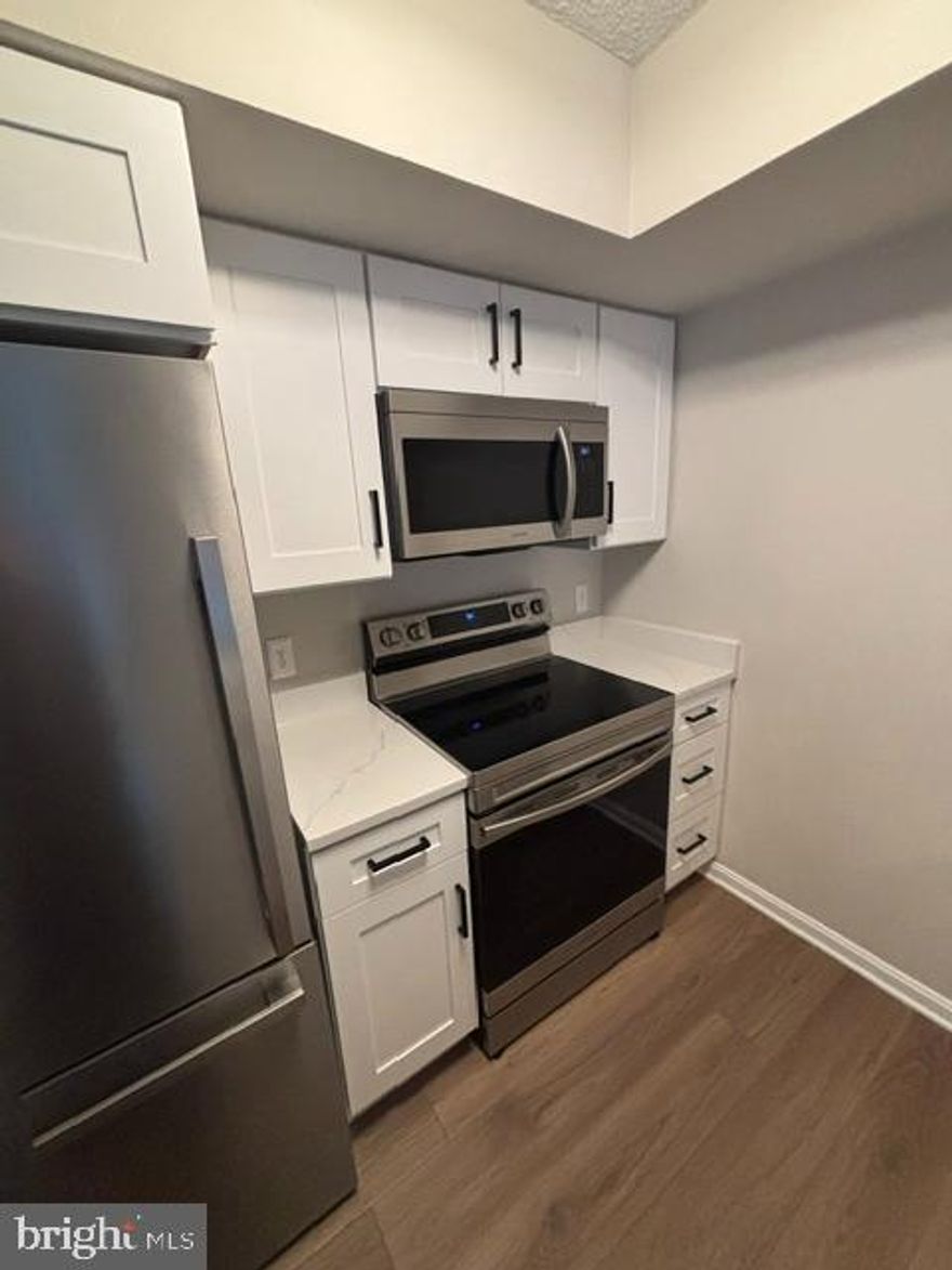 Step into luxury with this beautifully renovated home featuring modern upgrades throughout! The remodeled kitchen boasts brand-new appliances (fridge, microwave, dishwasher, oven, and stove), a larger sink, new garbage disposal, sleek quartz countertops, custom cabinets, a pantry, a coffee bar, built-in counter seating, and a beverage center.  

Both bathrooms are fully upgraded with new vanities, lighting, and mirrors. The guest bathroom includes a new bathtub, while the master ensuite features a custom glass shower. Each has unique tile flooring for a distinct touch.  

The bedrooms are outfitted with custom closets; the master includes built-in hampers and drawers, while the guest room offers abundant shelving.  

Enjoy stylish new LPV flooring throughout (except the sunroom), complemented by custom light fixtures in key spaces and customized window treatments that enhance natural light while maintaining privacy.  

The sunroom is a showstopper with a white brick accent wall and a new fan/light fixture, perfect for relaxation or entertaining.  

This home is truly move-in ready and thoughtfully designed for comfort, style, and functionality!