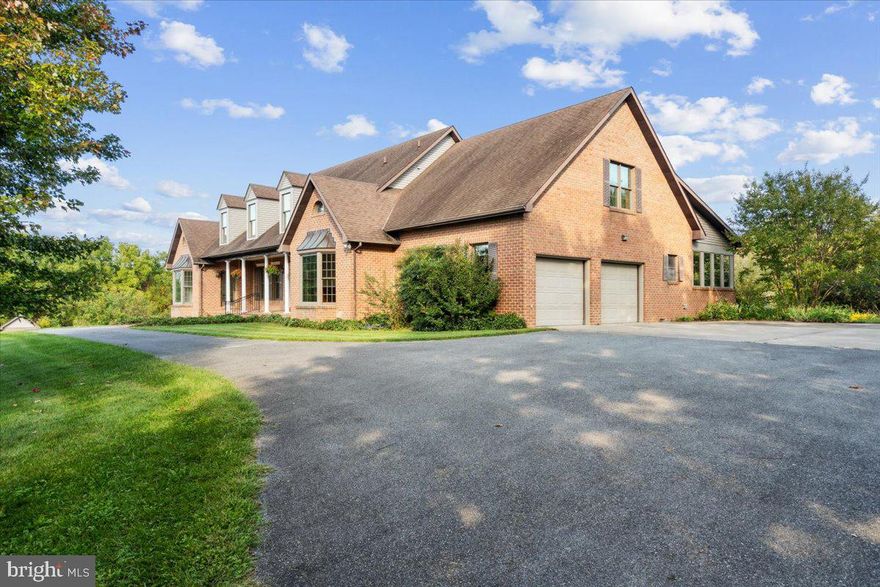 Welcome to your dream retreat nestled on 26 acres of pristine farmland near the base of Sugarloaf Mountain. Situated on a dead-end road, the property feels private and secluded but is only 40 miles from Washington DC. From the moment you arrive, you'll be captivated by the very rare opportunity this extraordinarily beautiful property provides. The expansive custom-built brick home is the epitome of solid craftsmanship —with high ceilings, custom woodwork, oversized light-soaked rooms, and stunning vistas. The entire interior has been newly painted and is move-in ready. Designed for single-floor living if desired, the main floor boasts hardwood floors throughout, and 2 separate owner's suites, each with large bedroom, en-suite bathroom, and separate entrance. At the center of the main floor is a large family/living room with a wood-burning fireplace and a beamed cathedral ceiling, creating an atmosphere both cozy and elegant. Off the family room is the large country kitchen, featuring custom solid walnut cabinets hand-crafted from trees on the property. Enjoy your coffee and meals in the dining nook surrounded by windows overlooking the backyard. The formal dining space features double crown molding and offers a beautiful setting for special occasions and family gatherings. The main floor also boasts a large office, with floor-to-ceiling solid walnut cabinets and wainscoting, all custom crafted from trees on the property. The office is perfect for remote work, with high speed internet service available from local providers or Starlink. Off the kitchen is a half-bath for guests, and convenience is key with a large main-level laundry room that includes a washer, dryer, sink, and additional cabinets for organization and storage. A stunning, sunroom, with custom cherry woodwork, tile floor, and panoramic windows invitesi the outdoors in and provides a serene space to relax and enjoy the beauty of the surrounding landscape. Off the sunroom and running along the back of the house is an expansive patio, great for barbecues, bird-watching, sunning, and relaxing. Upstairs, the second level boasts new carpeting and two additional bedrooms — each with its own bathroom — and a large bonus room ideal for a variety of uses, whether as an additional bedroom, playroom, media room, or hobby space. Walk-in attic space provides abundant storage throughout the second floor. The lower-level finished basement is an enormous 2488 square feet, consisting primarily of one gigantic room suitable for in-home business, playroom, meeting room, or retreat. The basement also boasts an office and full bathroom which could possibly be used as an in-law suite one day, as well as a gas log stove for additional warmth in the winter. Walkout double doors provide easy access to the expansive yard. The two-car attached garage offers secure storage for your vehicles. The property boasts a large private gated pool; a level and protected recreation area large enough for a tennis or pickleball court; a storage shed; a pergola covered with wisteria; and an old chicken house. Over the past four decades, the owners planted thousands of trees including specimen evergreens, oak, walnut, cherry, maple, hickory, redbud, dogwood, persimmon, fruit trees, and many others, so that the property today is a mix of forest, park-like landscaping, and rolling open fields. Privacy is paramount on this sprawling 26-acre estate, allowing you to escape the hustle and bustle of daily life and experience the serenity of country living. Yet it is in the highly-rated Urbana School district, and if you are interested in commuting to downtown DC, the MARC commuter train at Dickerson is only 8 minutes away with service to Union Station. Beautiful downtown Frederick is only 20 minutes by car, and for the outdoor set, the property is close to hiking trails and recreation on Sugarloaf Mountain, hiking and biking on the C&O Canal, and numerous historical sites.