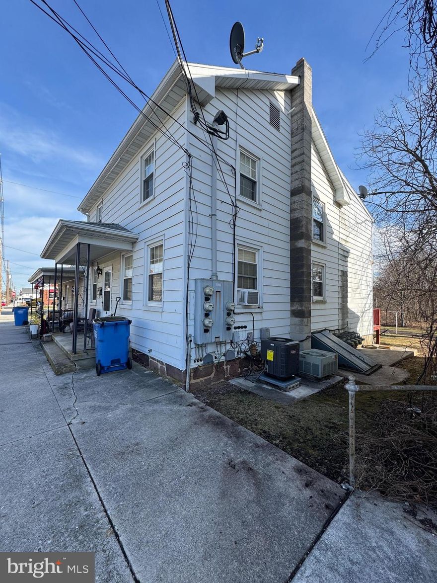Spacious 4 unit in very nice condition.  There are 2 buildings, the one on the right of the pic (2 1/2 story) has a unit down (149) and a unit up (153).  The 1 level building on the left has a unit in the front (151) and a unit in the back (153).  (4) 2 BR units with parking lot behind units, and also some off street parking.  All units under leases, with most appliances owned by seller.  Gas heat and central air in all units.  Tenants pay all utilities.  Owner pays taxes, insurance, and general exterior lighting. 
Shared driveway, not sure where lot corners are.