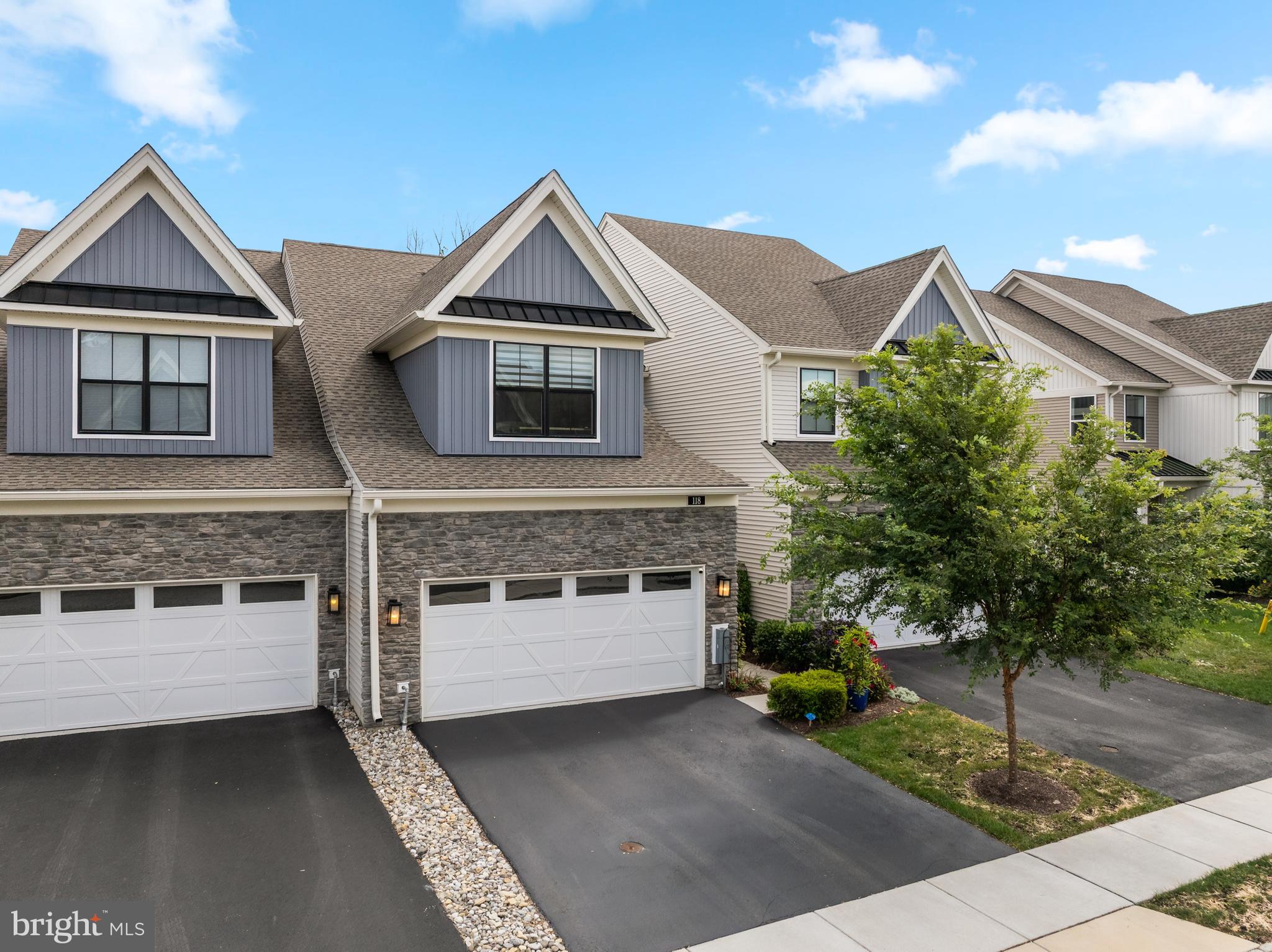 Welcome to this exquisite carriage collection townhome in the sought-after Franklin Station Community. This beautifully upgraded Pentwater Model has been meticulously maintained, featuring elegant landscaping leading to a welcoming front porch and entrance. The open-concept layout begins with a formal dining room featuring a tray ceiling, flowing seamlessly into a spacious living room with a gas fireplace and abundant natural light. Highlights include upgraded hardwood flooring, recessed lighting throughout, gourmet kitchen with Sub-Zero refrigerator, Wolf cooktop and hood, island, and breakfast nook, expansive rear deck with serene woodland & open space views, lower-level paver patio with flower beds, wainscoting woodwork, custom finishes, epoxy-coated garage floor and laundry room with built-ins and sink. The second floor offers a luxurious primary suite with vaulted ceilings, a spa-like bath with soaking tub, and a custom walk-in closet. Two additional bedrooms and a full hall bath complete the upper level. The finished lower level includes a full bath and walk-out access to the paver patio, perfect for entertaining or relaxing. Located in the award-winning Rose Tree Media School District, this home is within walking distance to the Wawa SEPTA station for easy access to Philadelphia. Enjoy proximity to Media’s vibrant dining and shopping scene, Ridley Creek State Park, and major routes to West Chester, Wilmington, and regional airports. Franklin Station amenities include a community pool, clubhouse, fitness center, and nearby walking trails—offering a complete lifestyle experience.