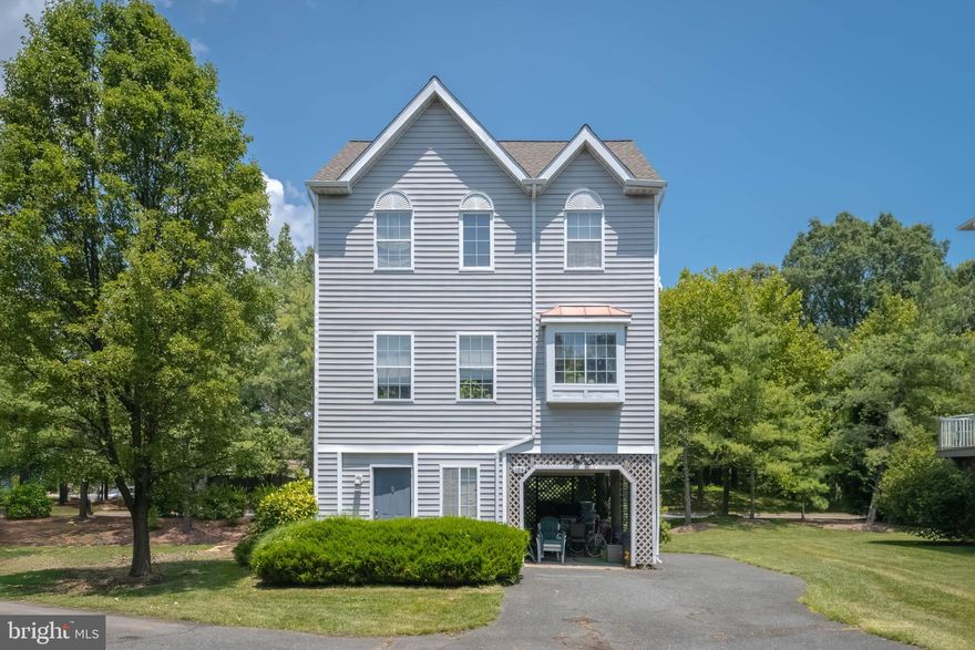 Find your dream retreat at Fairwinds, where the perfect blend of luxury and affordability awaits. This outstanding property includes a deeded 45 foot boat slip and lift, access to the community's impressive array of amenities, such as a playground, fishing and observation piers, a marina, and serene walking paths. The home itself boasts three bedrooms, two full baths and a half bath, with an open floor plan and a cozy private deck surrounded by trees. Don't hesitate  - come and experience this incredible property for yourself. With the HOA handling all the lawn care, you can enjoy life in this beautiful home and community.