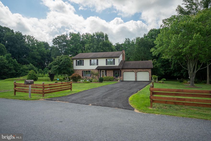 Situated on a large corner lot, this home has been lovingly maintained by the original owners.  Don't miss this traditional colonial with spacious rooms and many updates. Updates include the  freshly painted interior (2025) ,  hickory engineered hardwood flooring on the first level (2024), new carpet on the second level and stairs (2024), and updated bathrooms (2025).  The eat-in kitchen features open shelving,  butcher block counter tops, a large Fragranite sink and stainless steel appliances.  There is  a wood burning fireplace which is  the family room's  focal point. The first floor laundry room  is  very convenient; it has a utility sink, closet and the washer and dryer are included. The Anderson casement windows are a huge plus. The garage is oversized  (22' X 27.5')  which helps with parking and storage. In addition, the house has a large unfinished basement. The beautiful landscaping  adds to this property's  wonderful curb appeal, and the  paver patio (12' x 25' )  is great for outdoor enjoyment.  This home is ready for it's new owners. See it today!