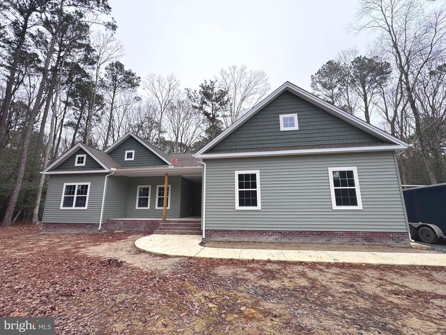 Quick Delivery -- Gorgeous Northampton model on 4.36 ACRES in Rosewood Forest, on Wicomico's East-side. Great location -  less than 30 miles to Ocean City Beach and Boardwalk or Fenwick Island beaches, minutes from Downtown Salisbury or Rt 50.  Wide open floorplan, high-end finishes, in this contemporary with Craftsman touches. 4BR/2.5BA, 2707sf of masterfully-designed living space on the 1st floor, and a large, finished bonus room on the 2nd floor. Welcoming foyer w/coat closet. Designer kitchen w/granite counters, breakfast bar, stainless steel appliances. Spacious living & dining areas. Living room features a custom fireplace. Dining area offers views of your yard, backing to trees, and access to the deck [to be built]. Luxury VP flooring throughout the living space, kitchen, bathrooms, & laundry room. Primary bedroom with access to the deck - full, en-suite bath - tiled, step-in shower, stand-alone soaking tub w/custom ship-lap surround, double-sink vanity w/granite top, walk-in closet. 3 additional bedrooms, a 2nd full bath with a tub/shower combo, double-sink vanity w/granite countertop. Laundry room.  Sizes, taxes approximate.  *** NOTE -- Any and all renderings, photos, floorplans, sizes, acreages are all for REFERENCE only, and may show upgrades + options NOT included in list price; subject to changes in the field. Owners are licensed realtors in Maryland + Delaware; listing agent has financial interest. Sizes, taxes are approximate. ***