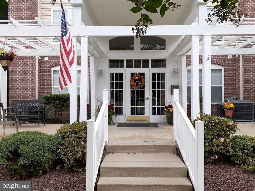 Take Your Adventures to a New Level!! This Unit May be Located on the Second Level, But it is First in Class Convenience and Condition. Elevator Equipped, Community Club House & Fitness Center, Tennis & Outside Pool Available.  Beautifully Maintained and Absolutely Move In Prepared. Screened Porch Faces Trees, Providing Privacy and Nature's Sights & Songs. Remote Start From The Unit to Your Car Parked In the Front of the Building. Master Suite With Walk In & Additional Closet.  Eat-In Kitchen, Kitchen Opens to Family Room, Crown & Chair Moldings, Formal Living and Dining Rooms. Generously Sized Bedrooms Each Have Their Own Bath.  Natural Light Abounds. Your Next Relaxation Destination. 5 Year Assessment Has Been Completely Paid.