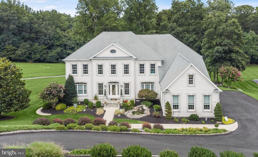 Welcome to 1935 Turnberry Court, an exceptional single-family residence nestled on the 9th fairway of River Downs Golf Course in the coveted community of River Downs. This stunning, meticulously maintained home boasts phenomenal curb appeal, over 7200 square feet of living space, and countless quality updates throughout the interior and exterior. As you enter the impressive two-story foyer with marble floors and an elegant dual staircase, you'll be greeted by opposing formal living and dining rooms featuring crown molding, beautiful hardwood floors, and plantation shutters. The main-level library, complete with custom-built-in bookcases, provides a perfect workspace for those working from home. The sensational family room is enhanced with floor-to-ceiling Andersen windows, a coffered ceiling, a gas-burning fireplace, and built-in shelving. The recently remodeled chef's dream kitchen (2022) features custom soft-close cabinetry, Quartz countertops, exquisite lighting, luxury vinyl flooring, and top-of-the-line appliances, including a Sub-Zero refrigerator. The inviting sunroom is the perfect place to enjoy your morning coffee. Retreat up the back stairs to the sprawling Owner’s Suite adorned with a three-sided gas-burning fireplace, sitting room, tray ceiling, plush carpeting, and crown molding. The completely remodeled primary luxury bath offers separate vanities, an oversized glass-enclosed shower with dual shower heads, a standalone soaking tub, and a huge walk-in closet. Three additional spacious bedrooms with plush carpeting, en suite baths, and walk-in closets provide ample space for a growing family. The finished lower level hosts a recreation room, game room, powder room, additional storage, workshop, and walkout level access. Enjoy outdoor living on the expansive deck and patio surrounded by gorgeous landscaping. The oversized three-car garage features newly refinished epoxy floors and a Gladiator wall system with cabinetry. Newly resurfaced driveway (2023). Other updates include the replacement of the main-level furnace. Luxury vinyl tile flooring was installed on the lower level. A new hot water heater (2023). A replacement interior well tank (2021), a repointed slate front porch, and septic cleaning.  Situated on 2 acres of picturesque land, 1935 Turnberry Court is the perfect home for families seeking luxury, comfort, and the ultimate golf course lifestyle.