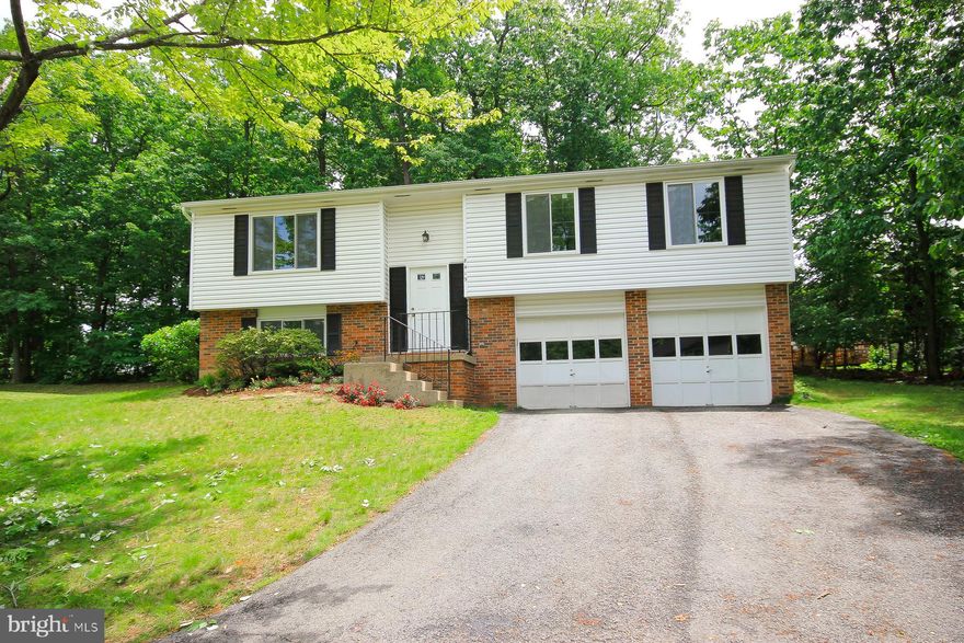 Location, Location, Location! Affordable home in Tysons Corner area with easy access to Beltway,DC, Virginia, Maryland, 267 (toll road), 66, 123, 7, and the Dulles Silver Line Metro. Great Features include Brazilian Cherry hardwood floors, renovated kitchen, with nice picture window to dining area, kitchen also has granite counter tops and upgraded cabinetry, off of main level is a nice sliding glass door and a deck, Home has a 2 car garage, great lot backing to woods, and much more!  This single family home offers privacy and safety at end of pipestem at end of cul de sac, and yet is close to tysons and metro and more!  Hard to believe so close to it all with so many trees around you.Great value in great location.  Easy access to Tysons Corner Mall and employment centers.  And also can get to almost anywhere in DC Metro area in a relatively easy drive.Owner has scheduled power wash for front exterior of home.
