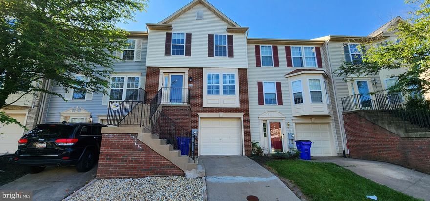 Discover this immaculate and cozy 3-level townhome featuring a partial brick front and a 1-car garage, perfect for commuters. The main level boasts an oversized living room, an eat-in kitchen with upgraded appliances, new flooring, a pantry, and a powder room. Step out from the kitchen slider to a deck overlooking a fully fenced backyard with a grassy lawn.

Upstairs, the primary bedroom offers cathedral ceilings and an en-suite bathroom with a whirlpool tub and dual vanities. Additionally, there are two more bedrooms and a hall bath. The basement level includes a laundry room and a finished area with a plumbed-in bar, perfect for entertaining.

This home is in great condition and ready for you to move in!