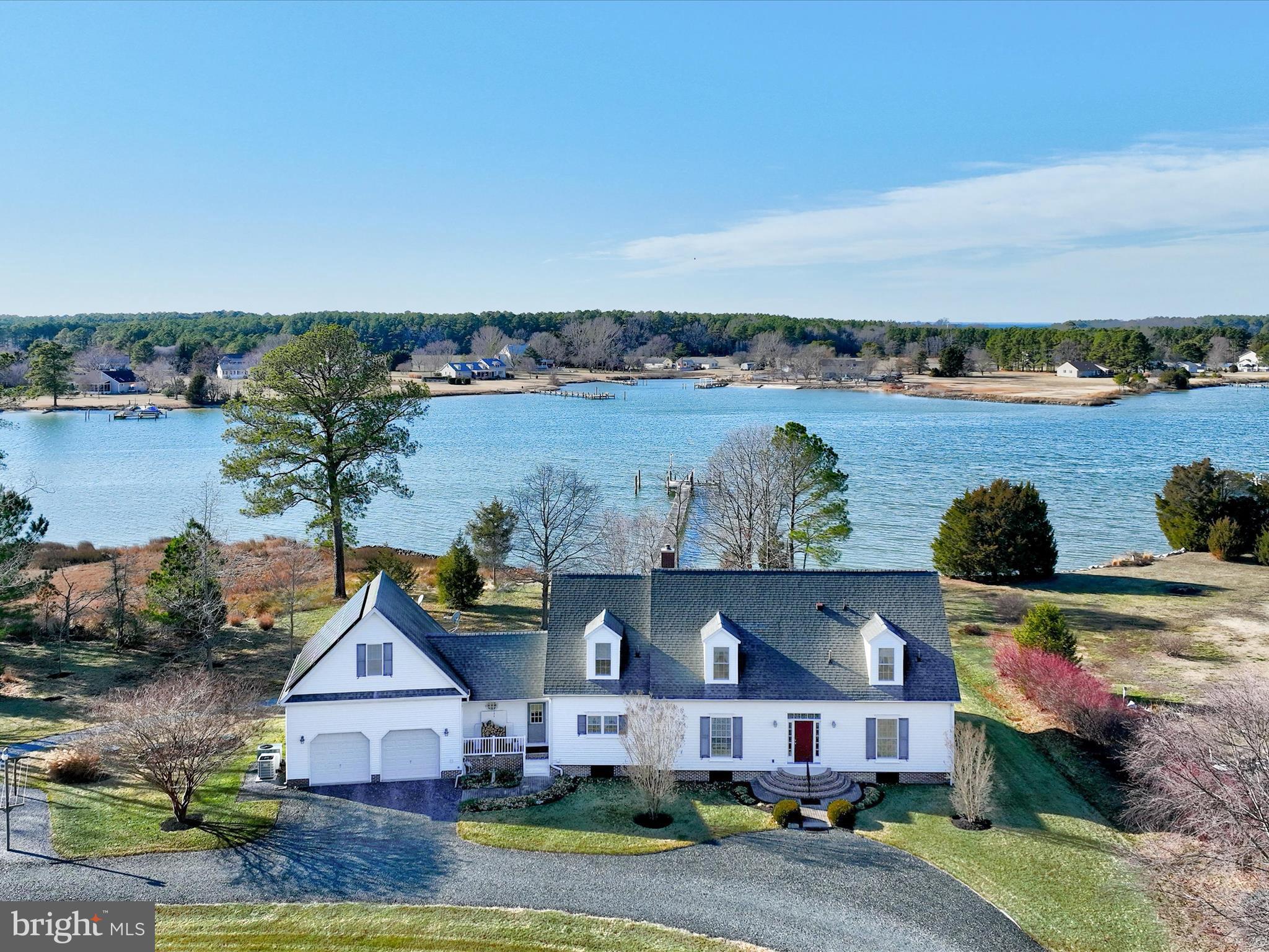 Find your own piece of paradise on this 5+ acre waterfront property. Owners took great pride and thought in constructing this wonderful country home. The house comes with 4 bedrooms 3 Baths with the en-suite primary bedroom located on the first floor. Property come packed with features like, attached 2 car garage with high ceilings, sun room to enjoy the lovely sunsets over Hudson Creek, centrally located wood burning stove and 6.9 kW solar array fully owned by homeowners which contributes to minimal energy bills.
Outside you will immediately fall in love with the hand built barn with a full mechanical workshop, separate woodworking shop, vehicle and tractor storage, wood and equipment storage upstairs with a barn hoist, and to top it all off a full bath with shower. There are two additional sheds for storage of gardening equipment, firewood and any additional gear you may have. The whole property has also been meticulously graded by the homeowner allowing rainwater to flow off the property quickly and efficiently.
The home has wonderful westerly views over the Hudson Creek. The 200 ft dock features water, power and a boat lift. Hudson Creek flows south to the Little Choptank River and then into the Chesapeake Bay which allow for endless exploring and fishing possibilities. Taylors, Tilghman, Solomon, Hoopers and Oxford are all easily accessible by boat for dockside dining.