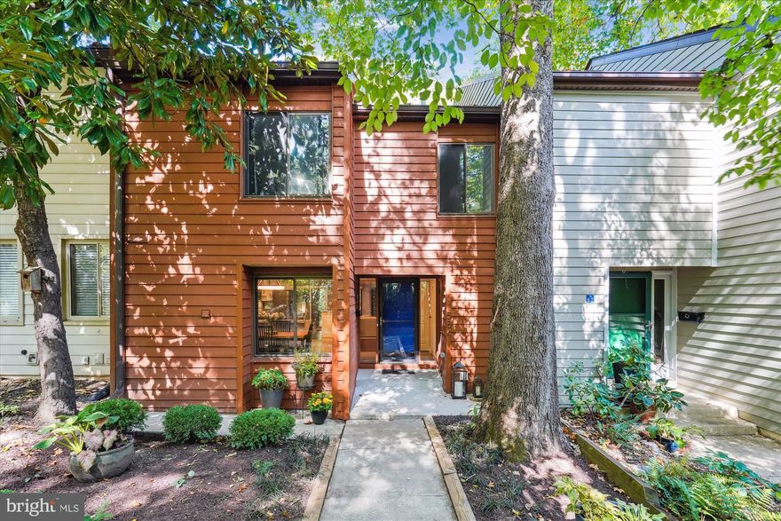 Beautiful townhome on a quiet cul-de-sac surrounded by acres of forest, 55 miles of walking trails, and one of 15 outdoor pools across the street along with tennis courts. A gorgeous kitchen renovation greets you upon entry with custom white cabinetry, stainless steel appliances, beautiful marble countertops, and tile backsplash. The LVP flooring leads into a lovely breakfast room with built-in cabinets and an aesthetic brick wall. A versatile family room with hardwood floors walks out to an enormous fenced-in deck, perfect for outdoor entertaining. An updated powder room completes the main level. The hardwood floors extend upstairs to 4 spacious bedrooms and 2 fully renovated bathrooms. The primary suite includes two closets and an ensuite bath remodeled with a frameless glass doored shower and beautiful tile work. All four bedrooms include ceiling fans; there are also custom window treatments installed throughout the home. The lower level offers a spacious recreation room, a 3rd updated full bath and a huge storage room. HVAC replaced in 2020, new insulation and HWH 2018. Kitchen and baths 2017. Windows replaced by prior owner. 1 assigned parking space with ample visitor parking spaces. The Wiehle Reston metro station is only 2 miles away offering summer concerts and tons of restaurants. Reston Town Center, Hunters Woods and South Lakes Shopping Centers are within 3 miles. Enjoy all of Reston’s wonderful amenities, explore Lake Anne Plaza and the Saturday morning Farmer’s Market, we also have a Trader Joe’s, Wegmans, and a new flagship Whole Foods. Only 10 miles to Tysons Corner and Dulles Airport. Terraset/Hughes/South Lakes pyramid. Live, Work & Play Reston!