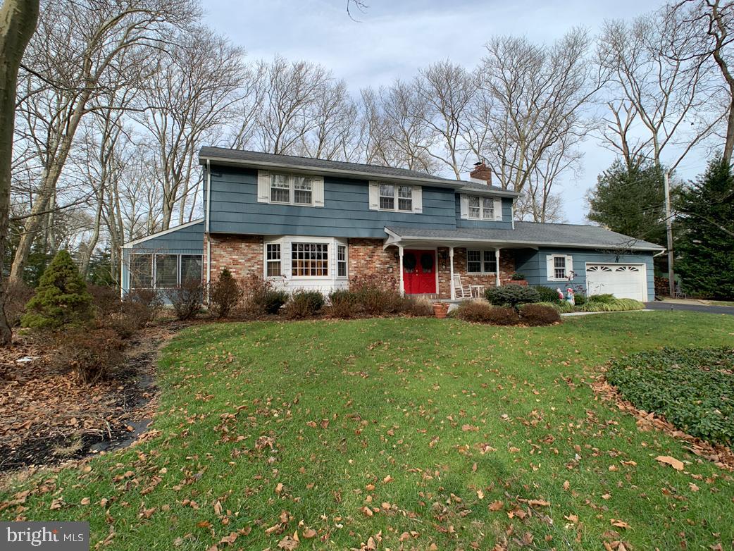You'll love this beautiful 2-story colonial home located just minutes from Yardley's Main Street with its wonderful dining, entertainment and shopping.  To add to the location this home sits in the award winning Pennsbury school district.  You will love the seclusion of the neighborhood which allows you to sit on the front porch and unwind after a long day at the office.  Children will have the luxury of being able to ride their bikes on the circle street giving you peace of mind as they play outside.   This home is a win-win from all the exterior befits to the gorgeous interior.  The rooms are large and spacious with beautiful hardwoods and crown molding in the living and dining areas.  These rooms flow into a screened in sun-room.  The kitchen has ample counter space for cooking along with a sizable walk in pantry.    This all leads you to enjoy the family room with its exposed beams and charming fireplace.  Upstairs there are four(4) spacious bedrooms and two (2) full baths.  The master bedroom features a large cedar walk in closet.  There are additional closets giving you plenty of storage space.   This home has everything including a partially finished basement which can be used for many purposes from your new man cave to children's playroom.  The "Trenton Cellar" in the additional part of the basement is there to fulfill all your storage needs and is easily accessible to the garage.   The rear of the home has a wonderful 16 X 42 deck which over looks the secluded back yard.   There are so many wonderful reasons to take a look at this home - from the newer roof (2013), appealing wood cedar siding (freshly painted),  central air and many other great features.  What are you waiting for - come see it for yourself!