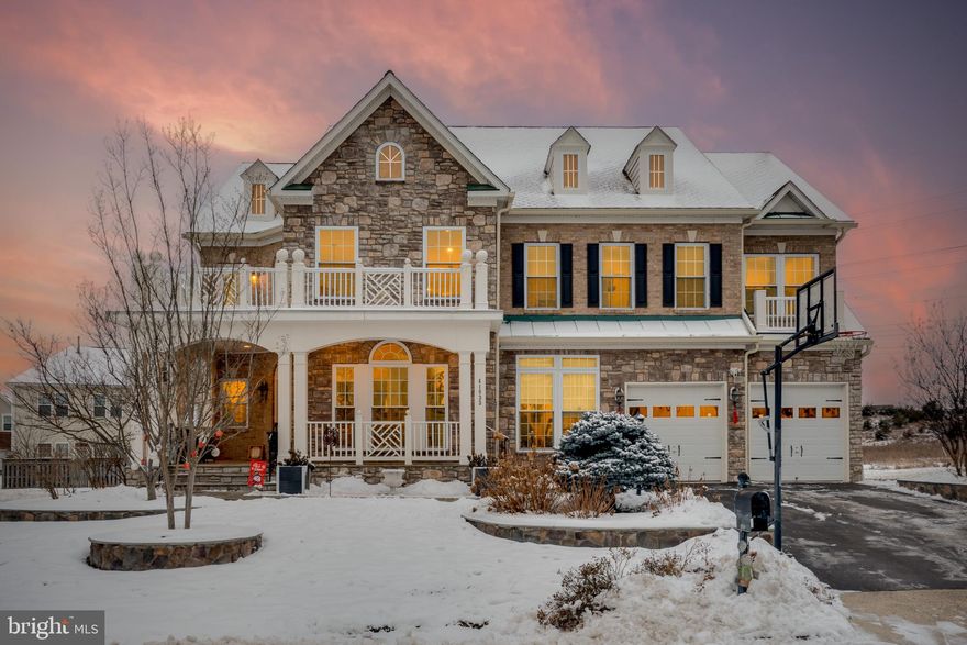 Exceptional Luxury Home in Stone Ridge – Over $250K in Recent Upgrades!
Step into the epitome of luxury living with this breathtaking 6-bedroom, 5.5-bathroom estate in the coveted Stone Ridge Community (Aldie). As one of the largest models in the neighborhood, this home stands out with its sophisticated design, high-end finishes, and unparalleled attention to detail throughout. As you enter the grand foyer, the stunning white floor welcomes you, seamlessly leading to the hardwood floors that flow across the main level. This level offers a perfect blend of elegance and functionality, featuring a formal living room and an expansive chef’s kitchen that inspires culinary creativity. The kitchen is equipped with premium appliances, an extra-large refrigerator ($15K), ceramic tile accents, and a striking waterfall island. Quartz countertops, stainless steel appliances, and a generous pantry complete the space. A sunny breakfast room and convenient main-level laundry with custom shelving and cabinetry round out this floor. The main level bedroom is a rare find, offering a full bath and walk-in closet, ideal for guests, in-laws, or multi-generational living. The home is bathed in natural light, with an abundance of windows and the added luxury of remote-controlled blinds for convenience and privacy. Upstairs, the primary suite is a private sanctuary, boasting an oversized bedroom with access to a huge private porch, perfect for morning coffee or evening relaxation. The spa-like en-suite bathroom features his-and-her vanities, a luxurious soaking tub, and a separate shower. Two spacious walk-in closets complete the suite. The upper level also includes a princess suite and two generously sized bedrooms, all featuring walk-in closets for ample storage. The fully finished basement is the ultimate entertainment space, featuring a custom bar, a state-of-the-art gym with rubber mat flooring, and a media room complete with a projector, screen, and surround sound system (worth $20K) – all included with the home. The basement also features a Control4 smart home system for seamless integration of entertainment, security, and comfort. Modern conveniences include an instant water heater, an additional 75-gallon water heater, a whole-house filtration system, and a whole-house water softener. The large garage, finished with painted floors and ceramic tile walls, includes shelving for storage, shoe racks, and an EV charger, adding to the home’s refined character.
Step outside to your private backyard oasis, designed for both relaxation and entertaining. The professionally landscaped grounds include a beautifully paved stone walkway and a large patio with a built-in grill cookout area and a cozy fire-pit. The covered pavilion with remote-controlled screens ($100K+ upgrade) provides the perfect space for outdoor entertaining year-round, no matter the weather. A hot tub connection is also available for added luxury. Additional features include a sprinkler system and landscape lighting, ensuring your outdoor space looks stunning both day and night.
The highly desirable Stone Ridge community offers an unmatched quality of life with a wide range of amenities for residents of all ages. Enjoy easy access to local shops, restaurants, and services, along with top-rated schools, including four elementary schools, two middle schools, a high school, and several childcare options. The community also hosts numerous events throughout the year, promoting a vibrant neighborhood atmosphere. For recreation and leisure, Stone Ridge offers three swimming pools, tennis courts, tot lots, a fitness center, and miles of scenic walking trails.
This home blends luxury, functionality, and convenience, offering an exceptional living experience. Don’t miss this one-of-a-kind opportunity!