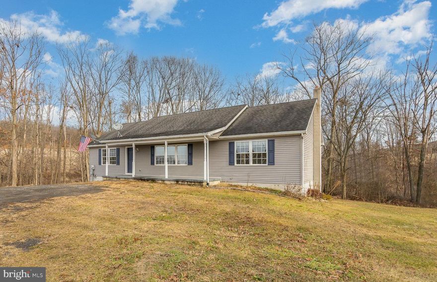Welcome to this well cared for ranch-style home nestled on over 2 acres of serene landscape with a picturesque wooded backdrop. Offering 1,539 square feet of comfortable living space, this delightful residence built in 2008 offers a perfect blend of tranquility and modern convenience.  As you step inside, you'll be greeted by a freshly painted interior that exudes a warm and inviting atmosphere. The main living area features an open layout, creating a seamless flow between the living room &  dining space opening to the spacious crisp white kitchen with ample cabinetry and counterspace.  A large pantry and laundry room  is conveniently located off of the kitchen.  This home features 3 sizable bedrooms, including a spacious primary bedroom with large walk-in closet & ensuite  bathroom complete with a corner soaking tub, perfect for unwinding after a long day, as well as a separate shower & linen closet.  A full walkout basement awaits your personal touch and offers ample space for storage or the potential to create additional living areas.  The lower level & garage are fully conditioned spaces with ductless mini-split systems,  as well as a wood stove.   Many recent upgrades including newer HVAC, freshly painted, newer solid surface flooring, and so much more! Beautifully situated on over 2 acres, you will enjoy the  expansive lawn space enveloped by the peaceful wooded backdrop  with a lovely stream running through.  Located in Greenwood School District  & Conveniently just 10 minutes to Route 15!
