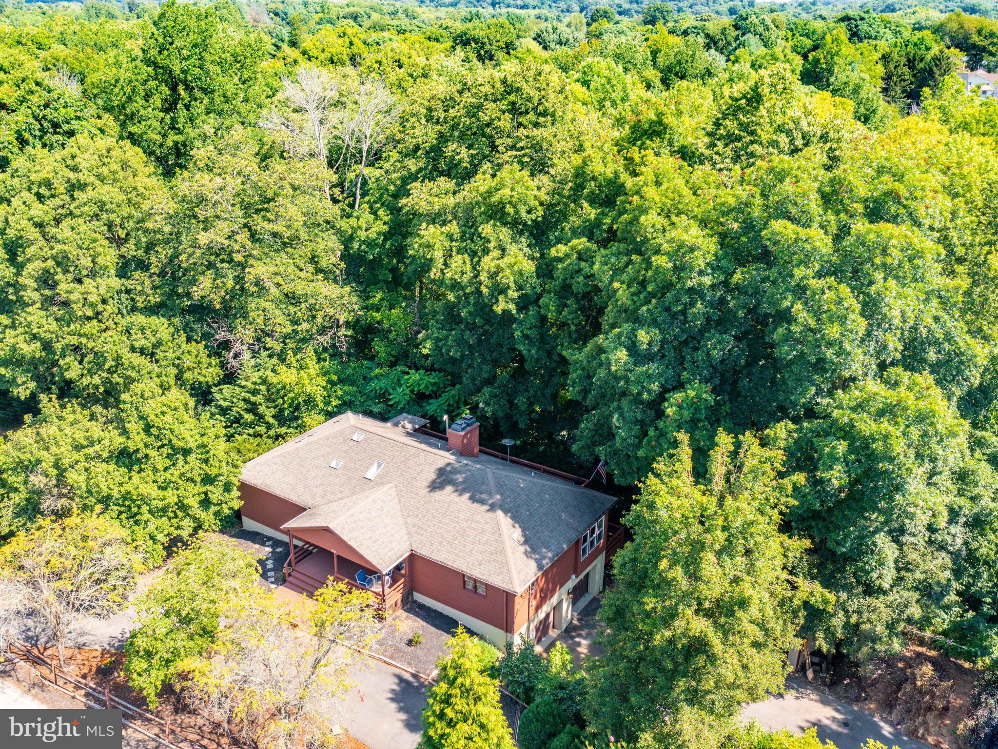 ****DEADLINE FOR OFFERS 5PM MONDAY 7/19/21.
Feel like you’re on vacation while you’re at home. With almost 4 acres of mostly wooded property
backing up to Bullskin Run you can hike the trail through your property or relax fishing for trout. Sit on
either one of two decks out back and listen to the creek. Relax in the built in Sauna on the top deck.
Take a walk down to the Shenandoah River with private access to 13 acres provided to Avon Bend residents. Large master bedroom suite on the first floor with a fireplace. Large kitchen
with granite countertops and stainless-steel appliances. Warm up in front of the fireplace in the living
room. Yes, lots of duplication in this house. 2 sinks in the kitchen, 2 dishwashers, double oven, washer
and dryer upstairs and downstairs, 2 decks on the back that run the entire length of the home, 2 car
garage. Tile flooring in some areas, bamboo flooring, carpet, and hard wood in other areas. 2 bedrooms
on lower level with walk-in closets and a full bath. Each bedroom has access to the deck. Don’t worry about carrying groceries up from the garage, there is an electric dumb waiter from the garage up to the kitchen. Too
much to list, a must see! Conveniently located close to downtown Charles Town and all commuter routes but very private at the same time. Owners also have purchased Trex decking to replace the entire top deck to make it maintenance free, but didn’t get time to install it, all this conveys to the new owner. Sellers are relocating to be closer to work.