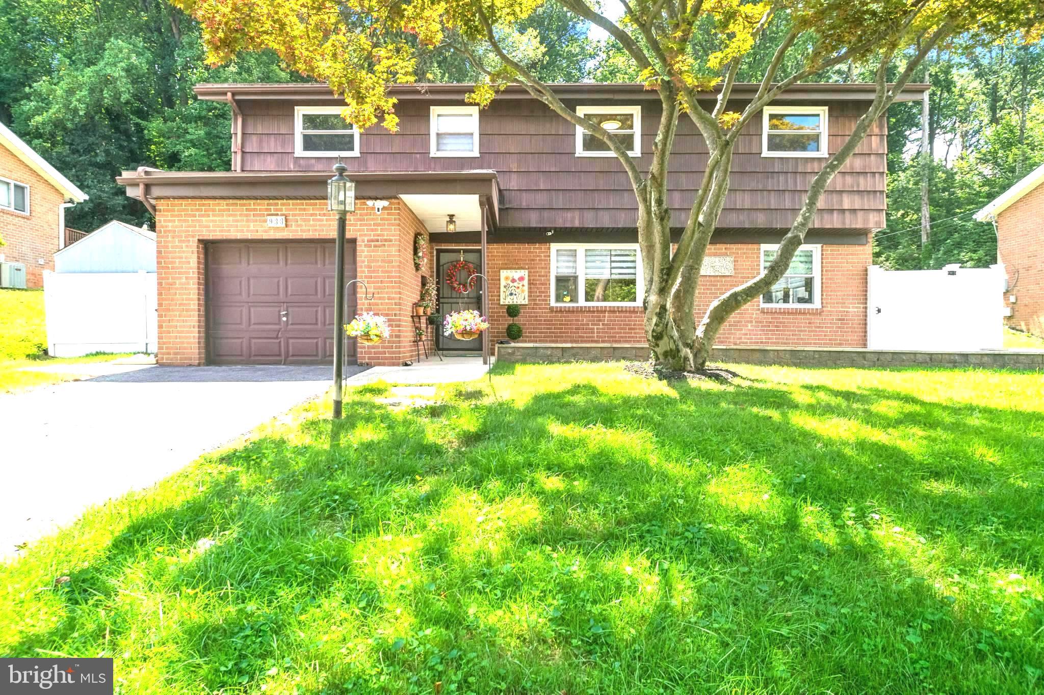 Welcome Home to this Spacious and unique 4 -level home with an enchanting back yard with one-of-a-kind view. Enjoy your own trailway to walk/hike in the afternoon and mornings. This is a true 4 bedroom home with 2.5 BA with plenty of space and a 1 car attached garage. The entry level offers a large kitchen and dining room with moisture-resistant laminate floors, granite counters, and the door out to a private fenced area. Take a few steps up into the main level where you enter a large light- filled living room with a large bay window, hardwood floors, wood-burning fireplace and sliding glass patio door leading out to the back patio and level backyard. A private bedroom with a bay window and its own half bath completes the main level. A few more steps up to 3rd level where you'll find additional three bedrooms with hardwood floors including a primary bedroom with a full bathroom with access out to the hallway. Third bedroom was converted into awesome closet space but can easily be converted back to a bedroom. The 4th level has a fully finished basement with a large rec room, a full bath and laundry room. All kitchen and laundry appliances purchased in the last 4 years. Newly installed 6-ft privacy fences on both sides of the house with stone patio. 8 ft. wood shed included. Front stone patio perfect for seasonal decor. Roof is inspected twice yearly by Arocon Roofing company and is in excellent shape. You will Fall in Love with this Remodeled Home so Convenient to Towson University, Hospitals & Schools. * Don't Wait....RUN! (NO PROPERTY SIGN)