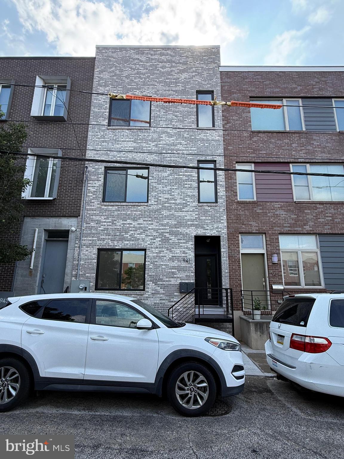 Available ASAP. This is a spacious Bi-Level 3BR/3BA with Rooftop Deck & Skyline Views! Welcome to this stunning, brand-new bi-level unit offering exceptional space, style, and city convenience. Located in a prime area surrounded by new construction and vibrant developments, this approximately 20-foot wide home spans the second and third floors of a modern building. The first level features a spacious open layout with one large bedroom, a full bathroom, hallway closet, Grand living room, dining area, and a sleek chef’s kitchen complete with stainless steel appliances—including a refrigerator, wine cooler, dishwasher, microwave—and elegant quartz countertops. Just off the bright living area, enjoy a private balcony perfect for entertaining or relaxing. Upstairs, you'll find two generously sized bedrooms, each with its own en-suite bathroom, as well as an in-unit washer and dryer for added convenience. All bedrooms comfortably accommodate king-sized beds. Top it all off with your very own full-sized private rooftop deck, offering panoramic views of the Center City skyline. This home is ideally situated near public transportation, major highways, and some of Philadelphia’s best dining and nightlife in Fishtown, Northern Liberties, and Center City. Don’t miss out—schedule your showing today!