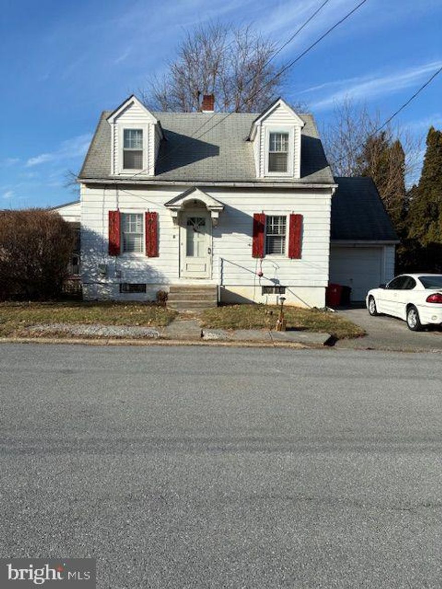 COZY SOUTH SIDE CAPE COD THAT HAS GOOD BONES BUT NEEDS UPDATING.  IT FEATURES HARDWOOD FLOORS, 3 BEDROOMS, 1 FULL & 1 HALF BATHS, LIVING ROOM, KITCHEN & DINING ROOM.  THERE IS A NICE SIZE LAUNDRY ROOM, WITH A LAUNDRY TUB, BUT NOT A WASHER & DRYER HOOK-UP.  FURNACE INSTALLED 2023 & FEATURES OIL HOT WATER CAST IRON BASEBOARD & RADIATOR HEAT.  WELL WATER WITH WATER CONDITIONER SYSTEM & PUBLIC SEWER.  10X12 REAR CONCRETE PATIO.  THE ROOF COVERED SIDE PORCH FLOOR NEEDS REPAIR.