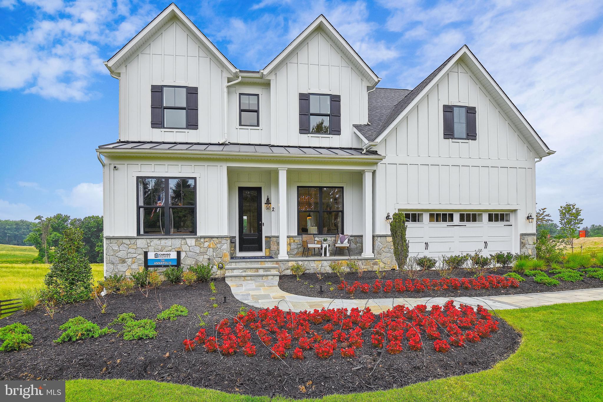 The Annapolis Craftsman is a single family estate home that comes standard with a 2-car garage. The main level features 10ft floors, a foyer with a formal dining room, and library at the front of the home. The rear of the home has an open format with a large great room that is open to a gourmet kitchen with a butler's pantry and large central island. This level also includes a mud room, powder room and in-law suite with a full bath. This home also features a morning room extension and a screened porch with outdoor fireplace. The second level offers 4 bedrooms, two full baths and a 5th bedroom with a shared buddy bath. The owner's suite includes two huge walk-in closets and an ensuite spa bath with a freestanding tub. A laundry room is also conveniently located on the second floor. The basement is finished and includes a rec room, a media room, and wet bar.
Photos are for representational purpose only. Please contact Sales Manager for more details.
Please contact Caruso Homes for further information about this home.
