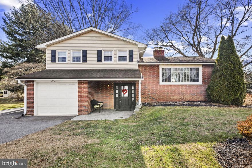 Spectacular four-level split offering gleaming hardwood floors, sun-filled interiors, and exceptional outdoor living. The spacious living room features a striking brick-profile gas fireplace and expansive windows that flood the space with natural light. The kitchen is beautifully appointed with stainless steel appliances, granite countertops, an island, abundant cabinetry, and seamless flow to the dining area—ideal for everyday living and entertaining.  The primary bedroom offers two closets and a private en-suite bath, while two additional bedrooms and a full hall bath complete the upper-level sleeping quarters. The lower level includes a generous second living room, powder room, laundry area, ample storage, and direct access to the backyard—creating a perfect extension of the living space.  Outside, enjoy professionally landscaped grounds, a patio for outdoor entertaining, secure storage, a covered front porch, and a one-car attached garage. 
This move-in-ready home is a must-see.