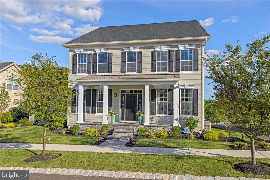 This is the rarest of opportunities to find tastefully appointed, newer construction available in the heart of Bucks County. Prominently located in the tranquil Fenton’s Corner neighborhood, among meandering walking paths, green space, & stunning scenery, this 4 bedroom, 3.1 bathroom property will suit your every need. Designed with high standard in mind, the layout is ideal for both elaborate parties and peaceful daily life. Invite your guests inside from the covered front porch, where the first impressions are the exquisite curved staircase and the wide-planked hardwood floors. The formal dining room to the left flanks the entertainment lounge on the right, complete with custom built-in dry bar and beverage refrigerator. One is immediately drawn to the glamorous white kitchen, which was styled for both form and function with high-end appliances, crisp white Quartz counters, slow-close cabinetry, an oversized island, upgraded transitional light fixtures, adjacent coffee bar, and plentiful storage. With open concept, the kitchen encompasses a spacious breakfast nook as well as the large great room with stone fireplace, fueled by gas, and abundant natural light pouring through. Off of the kitchen, all your cares will melt away when entering the south-facing screened-in porch with stone accent wall, gas fireplace, and built-in television system, surrounded by a sprawling EP Henry patio with custom landscaping. The backyard overlooks preserved land that's home to deer, fox, bald eagle, red tailed hawks, cardinals, blue birds, & red winged blackbirds. Back indoors and up the statement staircase, the elegant primary suite offers trey ceiling, abundant closet space with custom organization, and luxurious en-suite bath, all with million-dollar views of the natural landscape. Down the hallway, three generously proportioned bedrooms with ample closet space complete the upstairs, one with a private en suite and two sharing a jack-and-jill bathroom. The basement was carefully planned with upgraded 9’ ceiling height and rough-in for a future full bathroom. It could easily accommodate a fitness room, media room, wine cellar, or whatever you choose. Other sunny spaces include the main floor mudroom and laundry areas as well as the rear-facing, oversized two-car garage. Bursting with smart home features, energy efficient mechanicals, and timeless upgraded hardware and fixtures throughout. Enjoy a comfortable lifestyle, with lawn maintenance, snow removal, and trash removal maintained by the neighborhood HOA. It simply must be seen in person while it’s available.