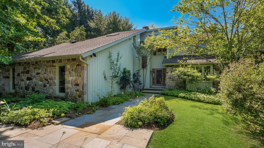 Stunning and Serene Contemporary Home nestled on 1.5 acres on one of the most peaceful roads in Doylestown! From the Private Winding Drive to the Intentional Landscaping and Specimen Trees, there is a Sense of Tranquility in this Home. This 5 Bedroom/ 3 Bath Home has Ease and Possibilities with two FIRST FLOOR Bedrooms, Two Bedrooms Upstairs and an Extra Guest Bedroom/Office/Studio in the Finished Lower Level. This is a home that is perfect for Multi-Generational Living! There is an Abundance of Natural Light and Views out every window. Walking up to the Home you notice the Custom Bluestone Walkway that was intentionally and intricately placed on a Diagonal.  Enter into the Two Story Foyer with Views into the Two Story Living Room straight out to the Lush Backyard. The Living Room features a Floor to Ceiling Stone Fireplace, Vaulted Wood Ceiling and Two Sliding Doors to a  Deck.  The "William Draper" Kitchen features Cherry Shaker Cabinetry, Granite Island with Pendant Lights, Radiant Heat Tile Floor,Thermador Appliances, Flush Thermador Refrigerator and a Double Oven. The Gourmet Kitchen is Open to the Good Sized Dining Room.  A Three Season Room next to the Kitchen offers a Cozy Screened Porch and a Side Entrance to the home.  The Sunken Sunroom sits just off the Living Room and is perfect for a Home Office, Library or Studio! TWO Good-Sized Bedrooms plus an Updated FULL Bath complete the Main Level. Heading Upstairs, there is an Overlook into the Living Room!  The Luxurious Primary Suite features its own  Fireplace, Vaulted Ceiling, and an EXQUISITE Bath with Radiant Heat Floor, HUGE Custom Shower plus a Separate Jacuzzi Tub , Skyights and TWO Walk-in Closets.  There is even a Balcony off the Primary Suite that looks over into the Sunroom plus a Spiral Staircase to the Sunroom.  A 4th Bedroom plus the Laundry Room complete the Upstairs. The Lower Level features a WALK-OUT Family Room with a Woodstove plus a Guest Room/Office with an Updated FULL Bath.  Sliding Doors lead to your Private Deck off the Family Room. The TWO CAR Garage is Insulated and provides good storage.  Outside, the Grounds are Spectacular and offer so many spots for relaxing and soaking in the Outdoors! There is an IN-GROUND POOL (24 x24) with a Trex Deck, a Bluestone Patio with Custom Firepit and Two Decks for relaxing and taking in the beauty of this property.  Okame Cherry,  Dawn Redwood, Katsura and Southern Magnolia trees are sprinkled throughout the property.  Award Winning Central Bucks School District.  Minutes to Doylestown Borough--but nestled in privacy and beauty. Pride of ownership can be seen throughout this home. Enjoy the Peace and Tranquility and Design of this Exquisite property!  Showings begin on Saturday, June 15th.