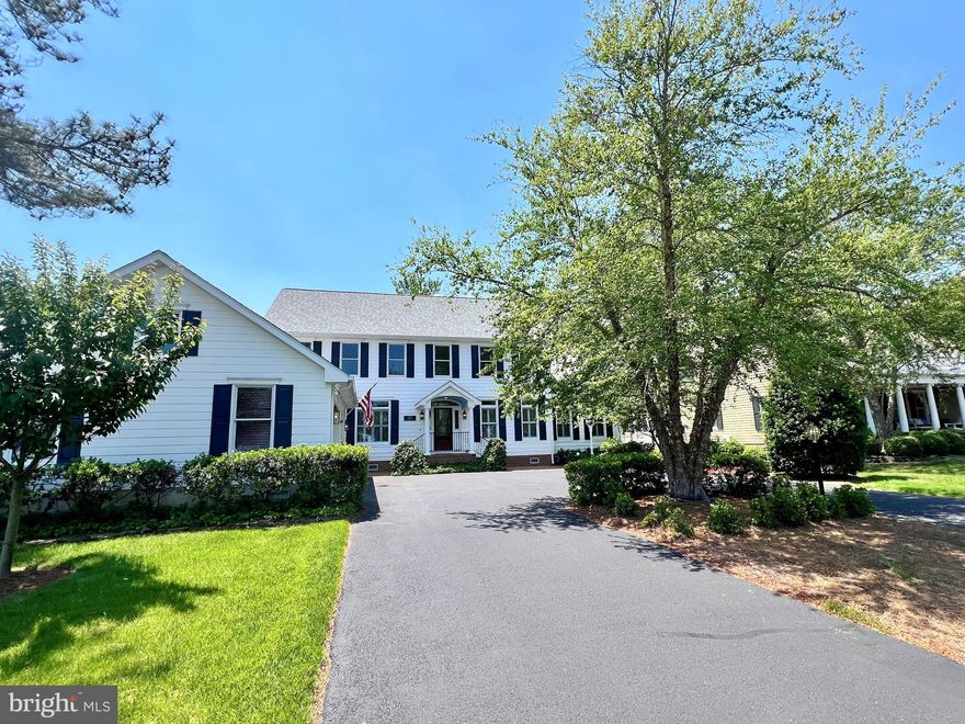 Welcome to 130 East Side Drive, a stately executive-style home located on the 8th Fairway of the Rehoboth Beach Country Club golf course. An extensive renovation has just been completed, including a new kitchen, bathrooms, roof, flooring, custom light fixtures, wallpaper, and more! You truly have to see this one to believe it. Upon entering through a custom mahogany-and-glass door, your gaze is drawn through the bright, airy space to the panoramic views of the golf course. Abundant natural light fills the living areas, making it feel spacious, welcoming, and relaxing. Upon entering the house, a dining room is to your immediate left, with a formal living/sitting room to the right. Both spaces feature tall ceilings, plantation shutters, and custom wallpaper. Continuing into the great room, an oversized chandelier and gas fireplace, flanked by sliding glass doors, give the area a feeling of luxury. The new chef's kitchen is an absolute dream, with custom solid-wood cabinetry, a 36-inch gas cooktop, gorgeous quartz countertops, GE Café matte-white appliances, a wet bar with a wine fridge, and a massive island with ample space for food preparation or entertaining. Pop-up power outlets are discreetly hidden in the island countertop, ready to power all of your favorite kitchen appliances. A large butler’s pantry is located off the kitchen with lots of storage, as well as the powder room featuring a beautiful navy vanity with a white Carrara marble countertop and fun coastal-inspired wallpaper. The laundry/mud room connects the butler's pantry to the garage and features built-in storage and additional cabinetry. A spacious primary suite is adjacent to the living room and features tray ceilings, plantation shutters, two large closets, and new hardwood floors. The spa-like primary bathroom features heated floors, a separate water closet, a double-sink vanity with a white Carrara marble countertop, and an oversized shower with multiple showerheads. Also located on the main level is a 5th bedroom, which could also be used as an in-home office. On the second floor, you’ll find 3 additional bedrooms, one with an en-suite bath, and an additional shared bathroom that connects the other two bedrooms. All bathrooms feature beautiful custom tile and lots of storage. Conveniently located off the rear guest bedroom is an additional room that would make an excellent playroom or craft space.

The exterior of the home is an entertainer’s dream with a spacious deck with a built-in hot tub, screened porch, fenced yard, outdoor shower, and magnificent sunset views over the golf course each day. Just imagine relaxing after a long day or hosting family and friends in your beautiful new space! The two-car detached garage has also been refreshed with new garage doors and motors, new paint, and an epoxy floor.

This stunning home is just a short walk to the RBCC Clubhouse. With the purchase of an additional membership, you can enjoy amenities such as fine dining, golf, tennis, and pickleball, a waterfront pool, and more. This lovely home has been thoughtfully renovated to provide a life of coastal luxury and convenience and awaits its next owner. Schedule a tour today!  5528-JL