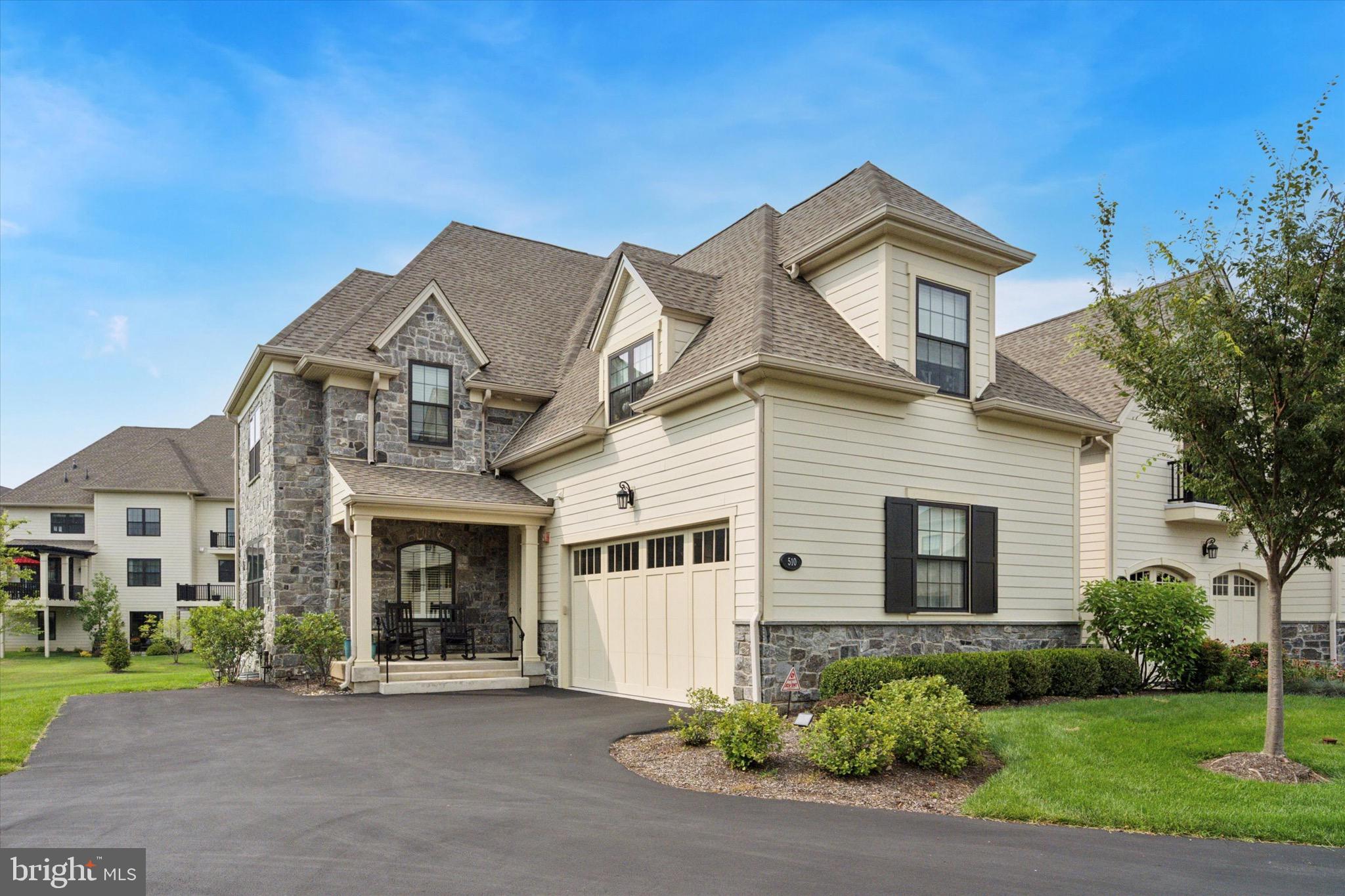 Welcome to 510 Valley Green Ct in the Reserve at Creekside – the area’s premier luxury carriage home community. This exceptional Wissahickon end unit offers 4 bedrooms, 4 full bathrooms, and 4,396 square feet of living space across three beautifully finished levels, all set in a premium cul-de-sac location.
The main level features hardwood floors throughout, a spacious great room with tray ceiling, crown molding, and a corner gas fireplace, plus a dining area with crown molding and chair rail. The private office/study is perfect for remote work, and the gourmet kitchen showcases upgraded white cabinetry, granite countertops, and premium black stainless appliances. A large sliding door leads to an expanded deck with steps leading to the expansive backyard. A full bath on this level offers the option for one-floor living.
Upstairs, the spectacular primary suite features a custom walk-in closet, two additional closets, and a spa-like bathroom with dual vanity, soaking tub, oversized shower, and private water closet. Two additional bedrooms, a hall bath, and a laundry room complete the second floor. The fully finished basement adds versatile living space, a workout area, storage and a fourth bedroom with a full bath. Additional upgrades include a full stone side elevation, newer carpet on the second floor and basement, custom lighting and window treatments, covered sprinkler heads, a 75-gallon water heater, water softener, and a new washer/dryer. The Reserve at Creekside offers maintenance-free living and exceptional amenities, including a 4,500 sq. ft. clubhouse with fitness center, gathering room, kitchen, and an outdoor pool with flagstone patio. Ideally located just minutes from Fort Washington and Wissahickon Parks, the shops and dining of Flourtown and Chestnut Hill, and with easy access to Routes 309, 476, and the PA Turnpike, this is a rare opportunity to own a move-in ready home in one of the area’s most sought-after communities.