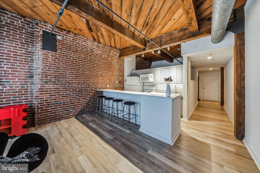 Experience the best of both worlds in this quaint one-bedroom, one-bath condo located in the heart of Olde City, Philadelphia. Rich in history and artistic ambiance, this unit seamlessly combines the character of the past with modern industrial style and an updated kitchen featuring luxurious quartz countertops.  As you step inside, you'll be enchanted by the harmonious blend of exposed brick walls, industrial accents, and contemporary finishes. The result is a unique living space that exudes character and charm.  Natural light pours into the open-concept living space through large factory-style windows, illuminating the gorgeous flooring.  It's an inviting setting for relaxation and entertaining.  The kitchen is a culinary haven with its stunning quartz countertops.   It's  highly functional with plenty of counter space,  making meal preparation a delight.  Just off the entry hall is the bathroom,  bedroom and convenient stackable washer and dryer.    The bedroom is spacious and includes double closets for extra storage.    The bathroom,  features a modern vanity and a soaker tub/ shower combo, creating a spa-like atmosphere for your daily self-care routine.  This condo offers a low-maintenance lifestyle, allowing you to savor all that Olde City has to offer without the hassles of extensive upkeep and comes with a private storage unit for those over-flowing treasures.  Rest easy with secure entry, door person and elevator access, ensuring a safe and private living environment.   The building also has a shared roof deck with amazing views and a courtyard on the first level with shared grills.   
Immerse yourself in the rich history and vibrant arts scene of Olde City. With art galleries, museums, historic sites, and an array of dining options just steps away, you'll have the city's cultural treasures at your doorstep.
Easy access to public transportation and major highways ensures you can explore the city and beyond with ease.   Don't miss the opportunity to own a piece of history with modern amenities. Schedule your showing today and embrace the allure of Olde City living at its finest.