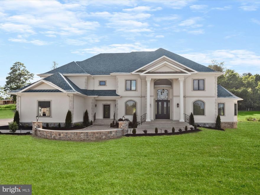 Victorian meets Mediterranean Luxury estate nestled in Ten Oaks Farm in Clarksville offering a sprawling 12,000 square feet of unmatched elegance set on a 3.03 acre lot. Energy efficient new build with 6 bedrooms, 8 bathrooms, custom features include hand crafted moldings, iron railings, hardware, banisters, exquisite imported chandeliers, imported Marble, and a 4-car garage with electric charger, this opulent residence is a masterpiece of design and craftsmanship.
Upon entering through the grand entrance, the stunning two-story foyer sets the stage for the luxurious features that await. Hand-crafted plaster moldings and custom ironwork add a touch of sophistication throughout, while polished porcelain floors guide you through formal living and dining rooms. 
The great room boasts a breathtaking 30-foot domed ceiling accented with stunning plaster moldings, a striking two story fireplace, and dual access to the expansive backyard.
The gourmet kitchen is a culinary dream with top-of-the-line Thermador appliances, walk-in pantry with built-ins, mother-of-pearl backsplash, a center island, wine fridge, microwave drawer, 42” custom cabinetry, display cabinetry, breakfast bar, and elegant imported travertine flooring. Enjoy casual meals in the adjacent breakfast room, surrounded by natural light.
The main level also includes a serene library with custom built-ins, a morning room with windows on all sides, second pantry with custom built-ins, and a guest bedroom with a private full bath and walk-in closet. Two powder rooms and a mudroom with built-in shelving and separate entrance complete this floor.
A curved custom staircase leads to the upper level, where the sumptuous primary suite offers a private sitting room with two Juliette balconies, coffered ceiling, and a three-sided fireplace. The en-suite bathroom is a spa-like retreat with two custom walk-in closets and an exquisite soaking tub.
Three additional bedrooms on this level each feature custom-designed en-suite baths with imported Marble, and walk-in closets, providing ample privacy and comfort. A laundry room and a striking overlook to the great room and entryway add convenience and architectural flair.
The lower level is designed for entertainment and relaxation. It features a theater room, a wet bar hook up, wine room with hardwood floors, and an expansive living area with an electric fireplace. An additional bedroom, full bath, walk-in closet, and a second laundry room offer versatility, while ample storage and extra wide walkout stairs provide easy access to the grounds.
The 4-car garage with epoxy flooring, electric car charger, and a 50-foot-wide driveway offer abundant parking and storage. A 16-foot-wide parking pad ensures plenty of space for guests and large gatherings.
Some photos have been virtually staged