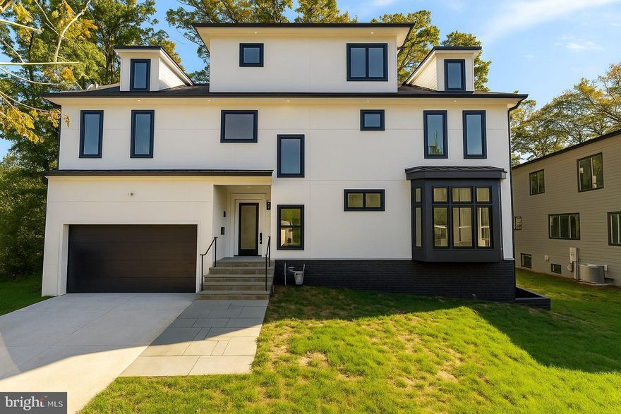 Welcome to 2237 Meridian Street, an extraordinary custom home designed for modern living in the heart of Falls Church. Set on a quiet residential street within the coveted Haycock, Longfellow, and McLean school district, this residence showcases over 4,200 square feet of thoughtfully curated space across four finished levels.

Inside, you’ll find six bedrooms and five and a half baths, with rich hardwood flooring running throughout. The main level features a showpiece chef’s kitchen with quartz countertops, top-tier appliances, and seamless flow into a bright and airy family room—ideal for both gatherings and day-to-day living. A formal dining room, mudroom with built-ins, and a two-car garage equipped with an EV charger complete the first floor.

The upper level hosts a serene primary suite with dual walk-in closets, a spa-inspired bath with soaking tub, and a glass-enclosed shower. Additional en suite bedrooms and a versatile loft provide ample room for work or play. The top level offers a private suite with full bath and generous flex space, perfect as a guest retreat or secluded office. The finished lower level expands the living space further with a large recreation room, an additional bedroom and bath, and endless opportunities for entertainment.

Outdoors, a fully fenced backyard creates the perfect setting for barbecues, family activities, or quiet evenings. With easy access to Metro, I-66, I-495, Tysons, and the Mosaic District, this home combines convenience with timeless style. An exceptional opportunity to own a brand-new residence in one of Northern Virginia’s most sought-after communities.