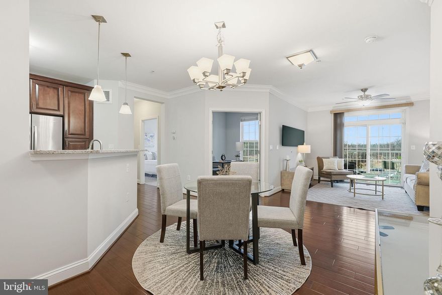 This 2 bed, 2 full bath condo in the highly sought-after Norbeck Crossing community is an absolute showstopper. Upon entering the building you will first notice it features an elevator for easy access. Once inside the unit you will be amazed by the spacious layout with a large, gourmet kitchen. It is a chef's dream with upgraded stainless steel appliances, ample storage in the abundant cabinets, gas range, granite counters and beautiful backsplash. The peninsula offers one eating option while there is also plenty of table space. Directly off the kitchen is a spacious, light-filled living room, which leads out to the balcony. Adjacent the living room is a cozy office space with doors for privacy. The primary bedroom is oversized and offers a large walk-in closet and en-suite bathroom with a walk-in shower and granite vanity. The second bedroom is also of ample size including a large walk-in closet with a full bathroom across the hallway. You will also notice there is an in-unit washer and dryer. Norbeck Crossing is conveniently located near the ICC, connecting you to all the major thoroughfares that can put you in Gaithersburg, Bethesda, DC, BWI and everywhere in between. It is also less than a 5 minute drive to all the shopping, dining and entertainment opportunities found in Olney.