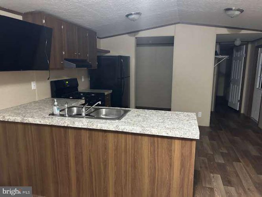 Must See!! Like-New 2021 3 bedroom, 2 bath mobile home with an open floor plan. Keystone Courts offeres community walking trails, playgrounds, and snow removal.