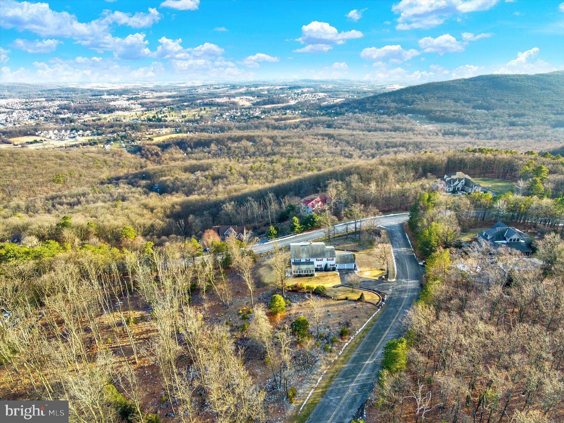 This house offers approximately 5,010 square feet of living space with five bedrooms and three and a half bathrooms. Situated on a lot of approximately 2.16 acres, this home is nestled atop South Mountain and surrounded by the tranquil Cumberland Valley. Enjoy the scenic views and beautiful sunsets from the all-season sunroom, which provides a peaceful sanctuary to take in the natural surroundings.
The property features walking trails, allowing residents to connect with the abundant wildlife and lush greenery. The cul-de-sac location provides a quiet, private setting, perfect for those seeking a serene retreat away from the hustle and bustle. This home is also capable of accommodating an in-law suite, offering flexibility for multigenerational living or guest accommodations.
Conveniently located, this property is within a two-hour drive of both Philadelphia and Washington, D.C., making it an ideal choice for those seeking a tranquil lifestyle with easy access to urban centers. This home presents a unique opportunity to immerse oneself in the natural beauty of the region while enjoying the comfort and space this property has to offer.
