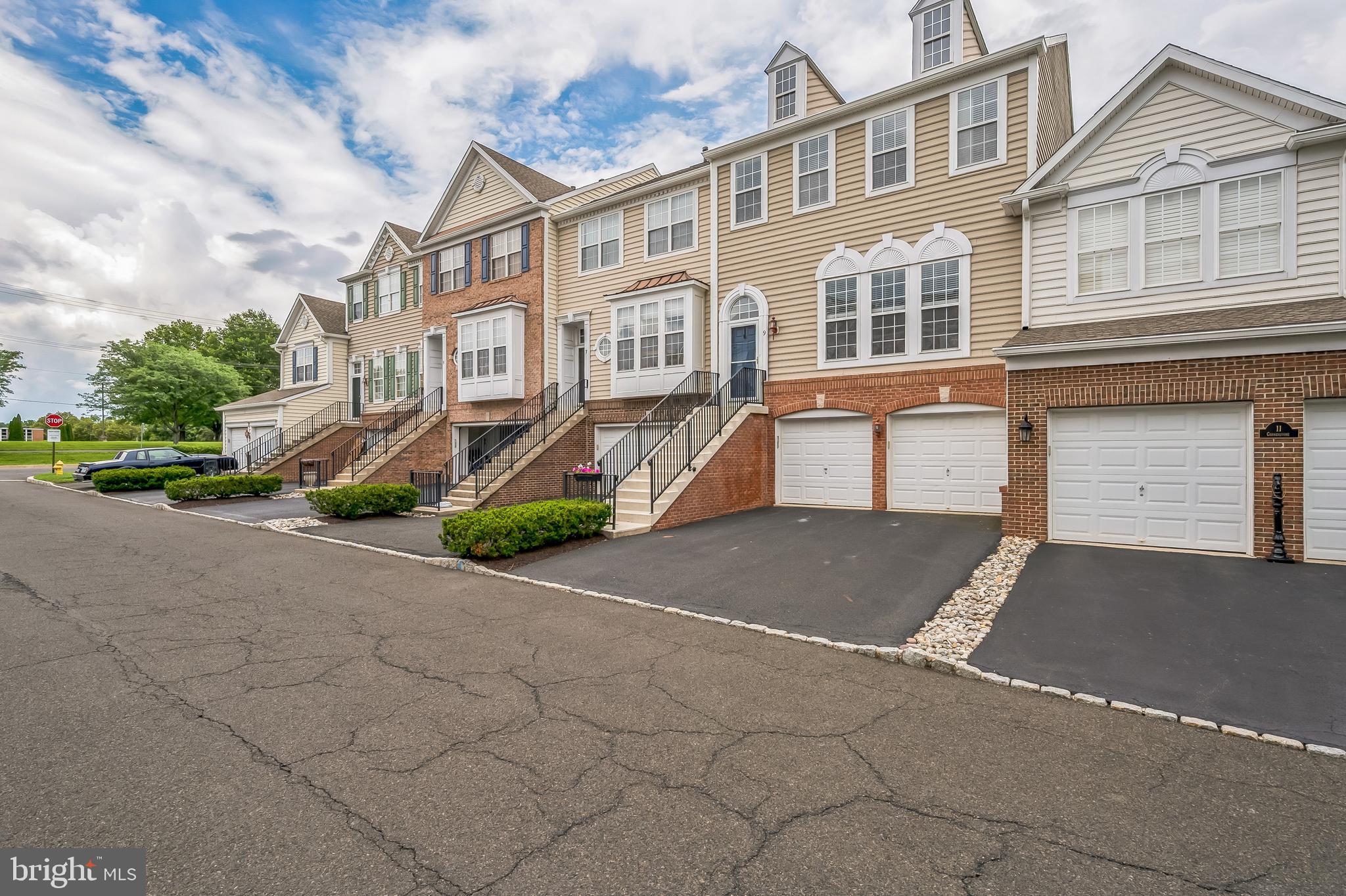This 4 Bedroom 3-1/2 bath luxurious town-home in Doylestown Station is The largest of the interior models, this expanded Brandon II town-home has a flexible floor-plan and is filled with open spaces and natural light. This sought after model has the "bump out" that gives you an added sun-room/office with a DOUBLE-SIDED fireplace PLUS the extra office in the finished basement. Hardwood foyer leads into gracious Living Room and Dining Room with custom crown molding and coffered ceiling. The gourmet kitchen w/ 42"inch cabinets, hardwood floors, has upgraded appliances opens to the tasteful Family Room with gas fireplace. Enjoy the sunshine in the extra sun-room that opens to the LARGE DECK over looking quiet greenery, great for entertaining. Upstairs, the master suite awaits with its tray ceiling and updated Master bath. Two additional bedrooms, full bath and an UPSTAIRS laundry complete the second floor. The finished basement offers an EXTRA office, full bath, and WALK-OUT and don't forget about the Private 2 CAR GARAGE. **ADDITIONAL UPGRADES: New Roof 2024, New Kitchen Appliances/Gas Stove, Hardwired Ethernet each floor, Moen Faucets. Conveniently, located to incredible shops, dining, and cultural attractions of Doylestown Borough. A short walk to Central Park and Kid's Castle. Also, in the award-winning Central Bucks School District which is one of the best in the area.