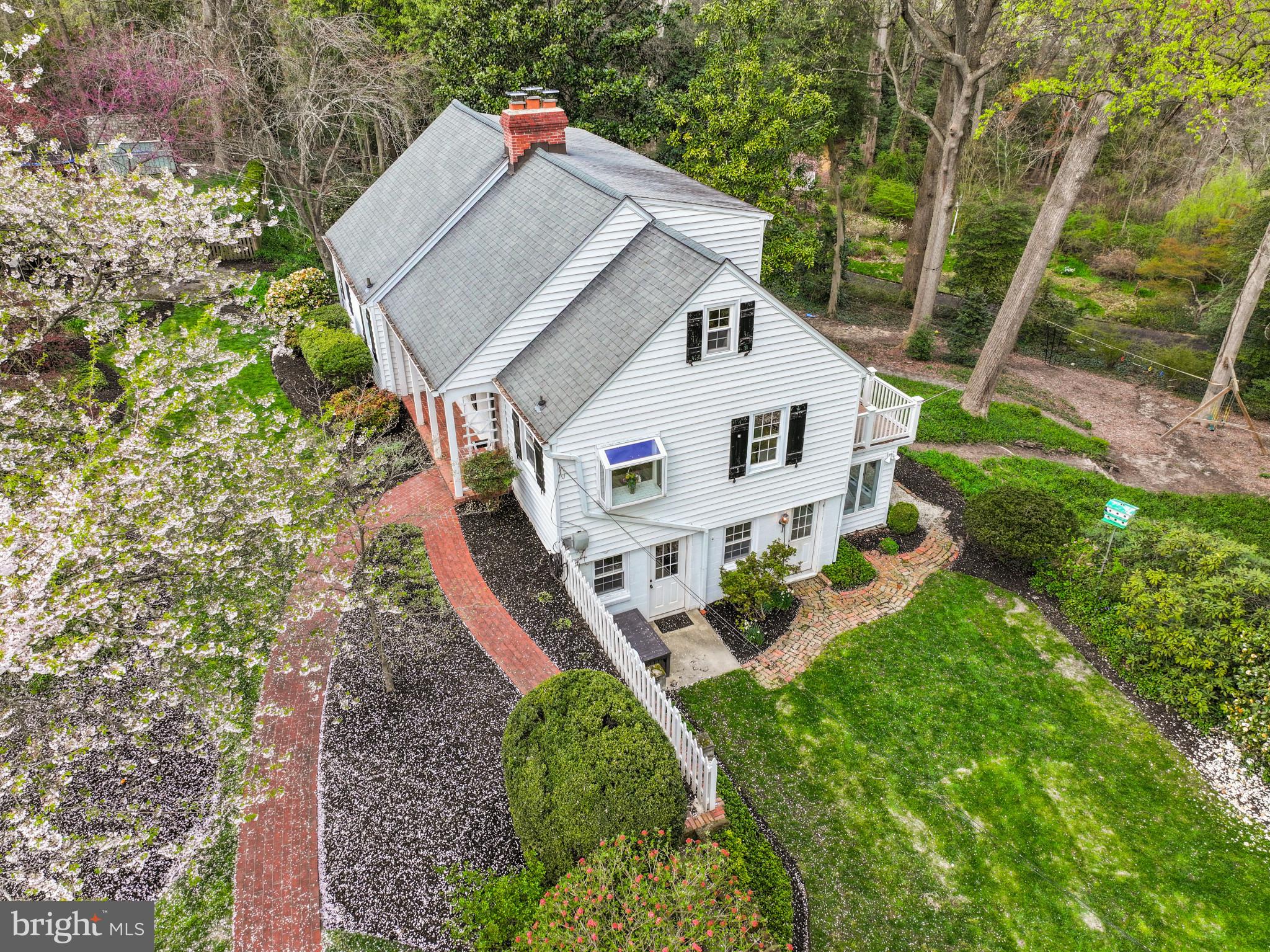 Nantucket style Cape Cod home perfectly located to capture the winter waterviews. Perched on an elevated 0.94 acre lot bordered by trees and overlooking Sullivan Cove this 4 bedroom 3 bath home combines cottage charm with modern amenities. Updated kitchen and baths compliment the preserved architectural details and pine wood floors. Charming details including built-in cabinetry, window seat, lower level coved ceiling, and decorative wood moldings enhance the appeal. The main level features an all white kitchen with high-end appliances and adjoining dining area which flows into the Living room with fireplace. Two spacious bedrooms with shared hall bath offer one level living. Upstairs an additional 2 bedrooms and beautifully remodeled bath provide plenty of space for family and friends. Natural light floods into the lower level through the walls of windows overlooking the backyard and play area. With a large living area, conveniently located half bath, built-in desk area, and laundry room, the space is filled with endless uses for the whole family. Located in the coveted Linstead on the Severn community, this sought after neighborhood boasts walking paths with multiple community beaches including the main beach with swimming area, pavilion, firepit, playground, and community pier with boat slips, boat ramp, mooring area, and kayak rack with launch area. The year round social activities makes everyday feel like a vacation. Walkable to shops, restaurants AND in the Blue Ribbon Severna Park school district, this property has everything you are looking for. Welcome Home!