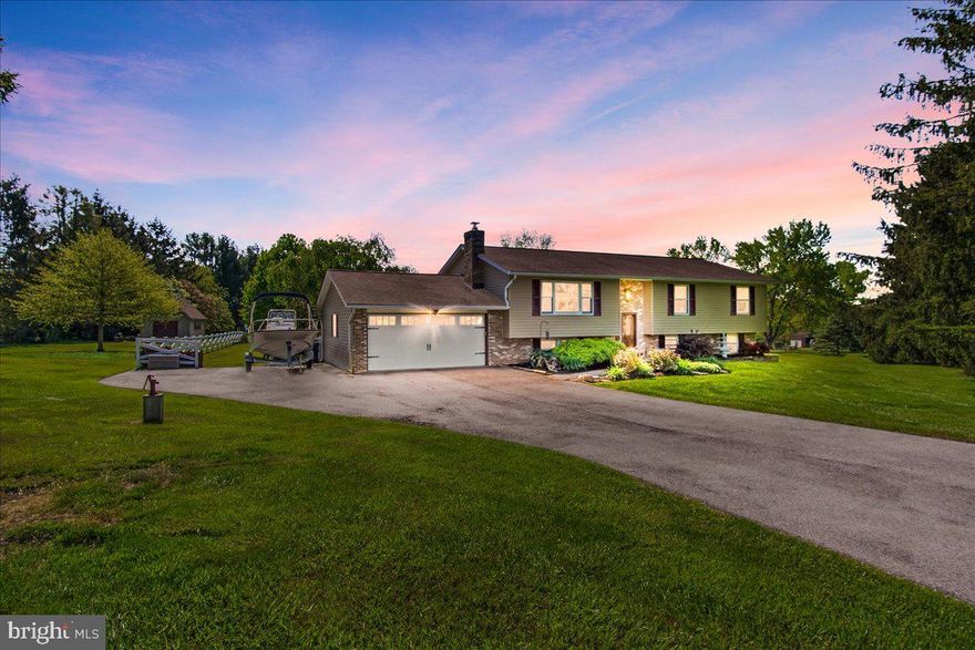 This beautiful home is located in a highly sought-after neighborhood, this property offers just over 2 acres of peace and privacy while still being conveniently located near shopping, dining, and major commuter routes. The expansive flat yard offers many great opportunities to have a large garden, playground, and whatever else you can imagine! The outdoor space and large deck offer endless opportunities for entertaining!  Almost forgot to mention a part of the yard is fenced in and has electric fence to keep all your pets safe! The house has 5 bedrooms with two primary suites, one on each level. The top floor primary suite offers an updated bathroom with a stand shower, while the downstairs primary offers a large soaking tub and stand up shower. There is generous storage throughout the home and a large laundry room that is ideal for crafts, sewing, and other projects. There is a two-car garage and parking for up to 8 vehicles in the large driveway. If this was not enough there is a large shed with storage on the main floor and the upper floor. The opportunities are endless with this home and large lot! The value in the land alone is worth a look!