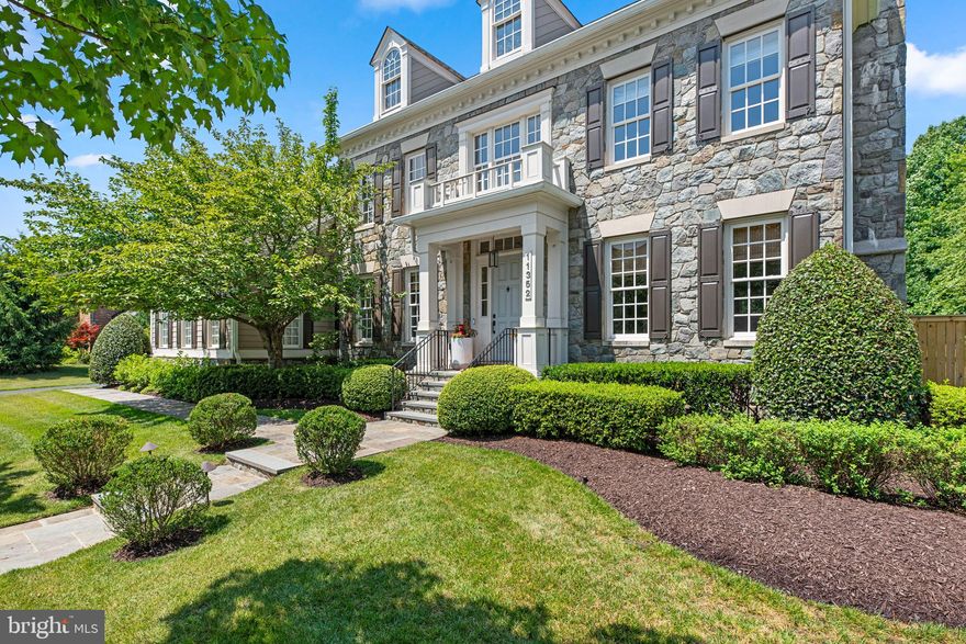 Experience the pinnacle of modern luxury in this beautifully updated Colonial home presenting timeless elegance and unmatched amenities with 5 bedrooms, 4 full bathrooms, 2 half bathrooms, 7,866 sqft, and a 2-car garage in the expansive and highly sought-after Maple Lawn community. Prepare to be captivated by the stunning curb appeal of this home, featuring a generous front yard with a black steel fence and beautiful stone paths leading to a fully-stone exterior. The lush landscaping is complemented by a charming trio of dormer windows, elegant neutral shutters, and a portico entryway crowned by a faux balcony.Step inside the main level, where elegant finishes abound, including wainscoting, crown molding, and hardwood floors throughout. The grand foyer features high ceilings and a curved staircase, leading to an office with French doors and built-in bookcases, a formal living room with a cozy fireplace, and a spacious formal dining room. Additional highlights include two half bathrooms, a breakfast area with a statement lighting piece, a mudroom with built-ins, a large storage closet, a freezer, outdoor access, and a recently installed HVAC system. The bright family room boasts a tray ceiling, a stunning chandelier, custom built-in shelves and cabinets, a stone gas fireplace, transom windows, and access to the back porch. The fully updated Chef’s kitchen is a cook’s dream with enthralling finishes such as gold fixtures and elegant pendant lighting. With quartzite countertops, a sleek patterned backsplash, custom white cabinetry, and top-of-the-line stainless steel Viking, Bosch, and Sub-Zero appliances, this kitchen is as functional as it is beautiful. Highlights include a farmhouse sink, a 6-burner Viking cooktop, a custom built-in range, a walk-in pantry, a seamlessly built-in refrigerator, a pass-through window overlooking the family room, and an oversized island with additional seating and a wine fridge.The opulent owner’s suite exudes luxury, featuring a raised sleeping area, transom windows, and a tray ceiling. The suite includes a sitting room with a built-in wet bar and a wine or beverage refrigerator, two custom walk-in closets, and a fully renovated spa-like bathroom. The bathroom boasts luxurious finishes, a standalone tub, a heated toilet, and an oversized glass-enclosed shower with a built-in shelf, bench, and aromatherapy and steam features. Additionally, the upper level features a luxurious bedroom with a walk-in closet, custom drapes, and a full bathroom boasting dual vanities. This bathroom offers dual access to another spacious bedroom with double closets. The fourth bedroom impresses with its cathedral ceilings, a massive walk-in closet, hardwood floors, and a private en-suite bathroom. For added convenience, a well-appointed laundry room with ample storage and a sink is also located on this level.The fully finished lower level is a masterpiece of entertainment and luxury, featuring a state-of-the-art theater area with a projection screen, a full bar equipped with a dishwasher, ice maker, wine refrigerator, and ample bar seating, expansive game spaces, a fitness room with wall-mounted mirrors, a full bathroom, a versatile bonus room, and seamless outdoor access. Step into the ultimate backyard oasis, with a recently installed fence and a convenient irrigation system in this meticulously landscaped retreat. Revel in expansive green spaces, a charming garden with enclosed herb beds, a cozy firepit, and a putting practice turf area. High-end touches include a decorative grass paver patio and a luxurious outdoor kitchen under an extended pergola, featuring ceiling fans, a large island with a refrigerator and seating, and built-in stainless steel appliances such as a gas grill, cooktop, sink, and pizza oven. Unwind on the covered porch, complete with recessed lighting and a fan for shaded dining and lounging.This vibrant community offers residents year-round events and a wealth of amenities.