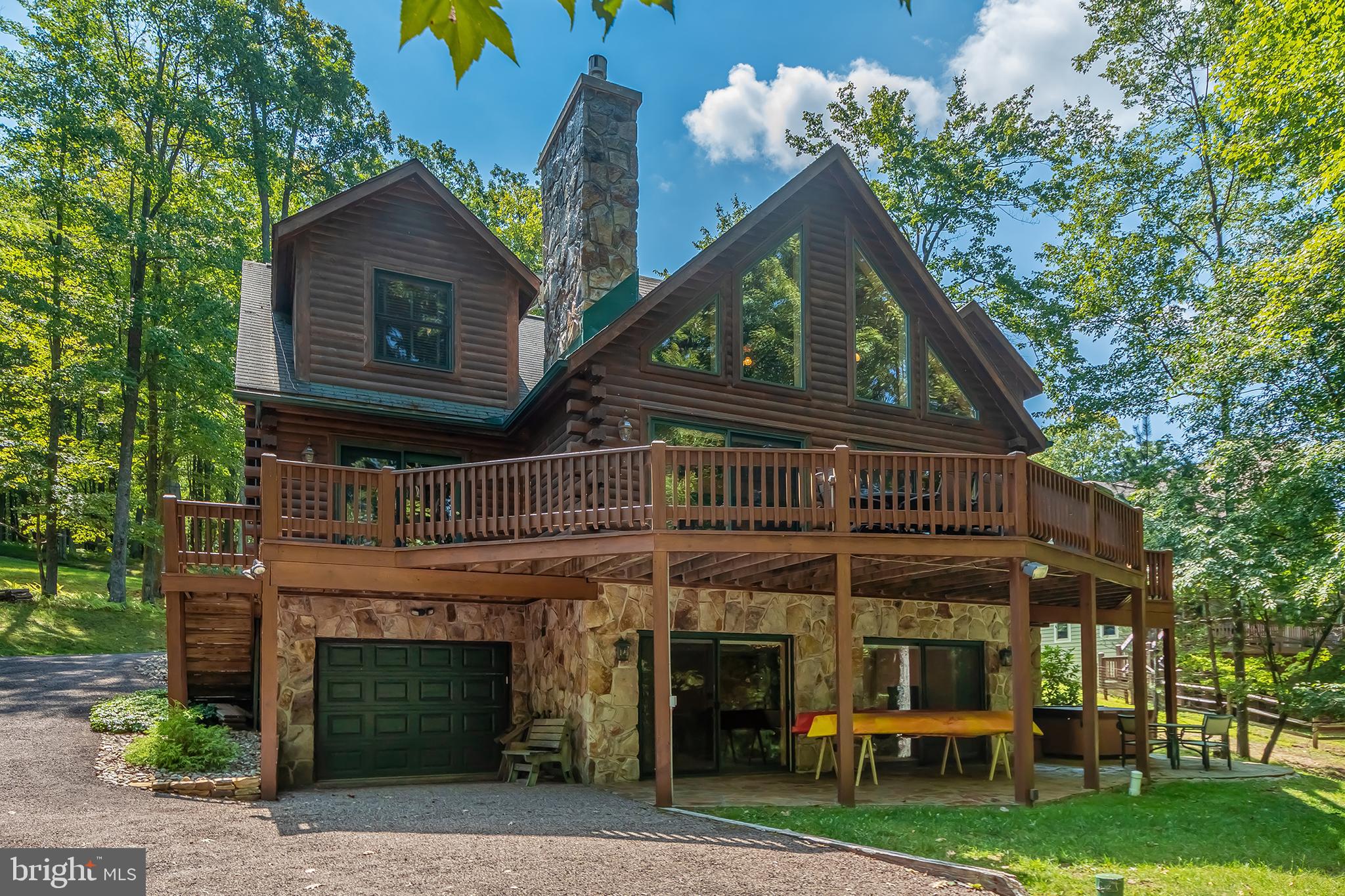NEW PRICE!!! Discover peace and tranquility in the prestigious North Shores East community of Thousand Acres. This beautiful lakefront Mountaineer log home offers spacious rooms, rustic wood construction and great craftmanship, all of which add to the charm and uniqueness of this home. The open floor plan lends to seasonal lake views and outdoor access from most rooms. No need to worry with a whole house generator to depend on. Lots of additions such as a sea wall, central air-conditioning, expanded Type A Dock, exterior lighting to the lakefront and tankless hot water heater. Relax in the evening around the firepit! Owners have taken special care maintaining this home. The wide plank wood flooring is exquisite and all interior doors are solid, 6 panel. Call today for a preview. Sellers are offering to include Lot 28 Laurel Drive, Oakland, MD 21550 to the Buyers at settlement for no additional charge!!!