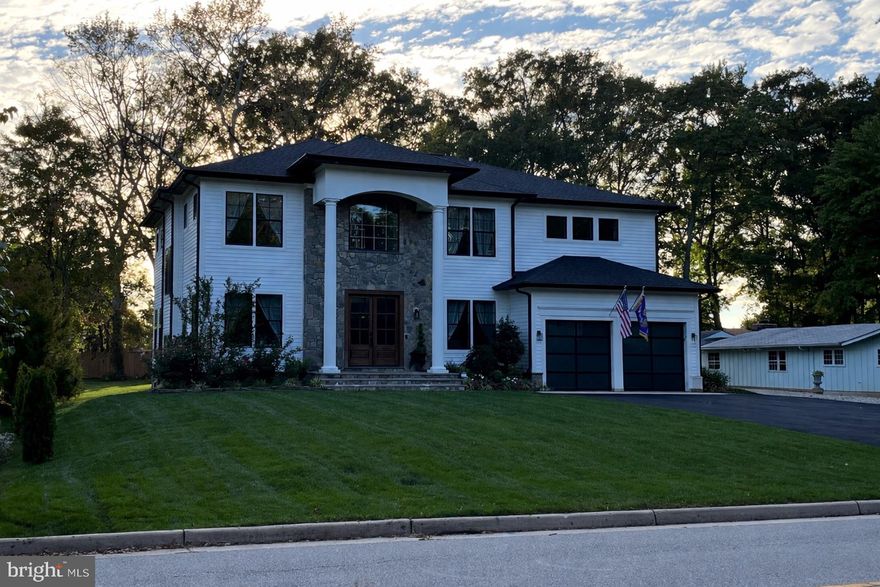 This stunning nearly 5500sq. ft. custom home offers five spacious bedrooms and six full bathrooms across two beautifully designed levels, blending elegance with modern comfort. A grand stone façade and stately columns create unforgettable curb appeal, while inside you’ll find an open, light-filled floor plan enhanced by soaring 10-foot ceilings, extensive crown molding, and beautiful wainscoting throughout. The gorgeous white chef’s kitchen serves as the heart of the home, flowing seamlessly into expansive living and dining areas designed for both everyday living and elegant entertaining. Generously sized bedrooms, luxurious baths, and refined architectural details add to the home’s upscale feel. Step outside to an impressive outdoor living space featuring a grand paver patio and a massive built-in fire pit—perfect for hosting gatherings or enjoying cozy evenings under the stars. The full basement is already framed and ready to be finished—just add drywall and electrical to instantly expand your living space and equity. This exceptional property combines space, craftsmanship, luxury, and opportunity in one remarkable package.