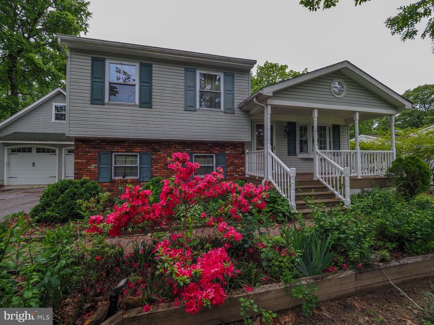 4 Level Split with 2 car detached garage. Extended Garage has a rough in for a bath and a large loft area, fully insulated and drywalled with 100 amp service for all of your tinkering desires. The home is spacious with 3 bedrooms, including owners suite with walk in closet and attached half bath as well as private balcony.  Large lower level with bar.  Big enclosed rear porch leads to huge back yard with 2 storage sheds and gazebo.