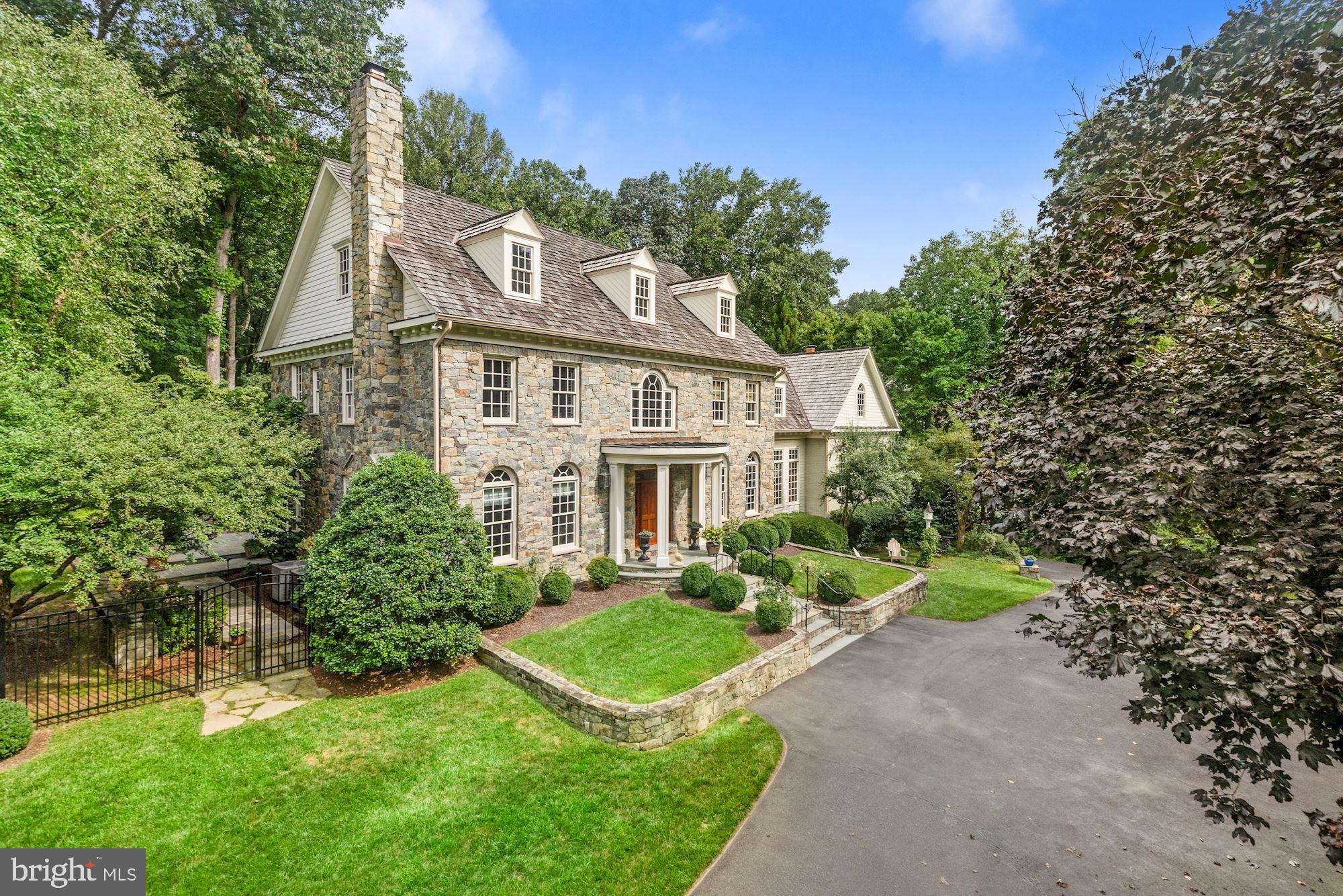 JUST LISTED! HANDSOME AND TASTEFUL STONE AND BRICK GEORGIAN STYLE HOME ON 2 ACRES WITH FULL HOUSE GENERATOR, UNDERGROUND SPRINKLER SYSTEM, FENCED REAR GARDEN, TERRACE WITH FIREPLACE, EMBASSY SIZED LIVING ROOM, LIBRARY AND OFFICE, 5 BEDROOMS, 5 FULL + 2 HALF BATHROOMS, 2 CAR GARAGE WITH ROOM FOR 3RD CAR, KITCHEN WITH ALL STAINLESS APPLIANCES, WALK-OUT LOWER LEVEL, RECREATION ROOM, WORKOUT ROOM, CRAFT ROOM ETC. A MUST SEE FOR GRACIOUS LIVING - AND MINUTES TO DC, TYSONS AND ALL POINTS IN MARYLAND.