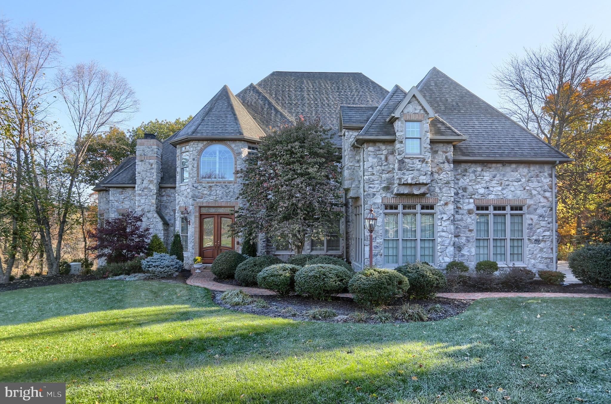 Stunning is the word that comes to mind when arriving at this home in the desirable community of Pinehurst Hills. Everything about this home speaks to Luxury and Distinctive Living. So Elegantly Appointed, this home is nestled on a gorgeously manicured lot and offers a total of 5 Spacious Bedrooms , 6 Full Baths and 1 Half Bath. The Impressive Foyer with Gleaming Tile floors leads to a Living/Great Room with beautiful crown molding, wainscoting, and a fireplace that can be either wood burning or gas. The Formal Dining Room has an amazing coffered ceiling with a unique double chandelier and will comfortably seat a larger family - the Dining Room also provides convenient access to the deck. The adjacent Family Room has gleaming hardwood floors, a vaulted ceiling that soars to 20', a Juliet Balcony and another cozy fireplace. The expansive chef-quality Gourmet Kitchen with hardwood floors offers upgraded appliances, a gas stove AND an electric stove, granite counter tops that provide a ton of prep space, a wine cooler, a pantry and access to the huge 100' deck. The cozy Hearth Room, located off the kitchen, provides wonderful natural light from the impressive windows and is the perfect place to just relax and unwind. There is also a Powder Room conveniently located on this main level. As you make your way upstairs, the stunning Primary Suite offers hardwood flooring, a fireplace, a coffee bar and an amazing en-suite bath with ceramic floors and granite vanity tops, walk-in closet and attached sitting area - the result is a retreat that is luxuriously comfortable. You will also find 3 additional bedrooms - each with an attached full bathroom - walk-in closets, and unique ceiling finishes. The lower level of this home has been beautifully finished and is perfect for hosting small family gatherings or more lavish get-togethers for friends/neighbors/colleagues. There is a 2nd Family Room with an absolutely stunning bar area with all the necessary appliances, a private office that is conducive to working from home, a bedroom, game area, a craft room, 2 full baths and a custom, Amish built dry stack stone gas fireplace - you will find that every aspect of family living and entertaining is supported by this beautiful home. Everything is so tastefully done and warm, sophisticated opulence characterizes every room. The attention to detail is unparalleled - there was absolutely nothing overlooked. Situated at the end of a cul-de-sac, the impeccable design blends seamlessly with the surrounding homes. Plan a visit today - a home this Impressive is truly a Rare Find.