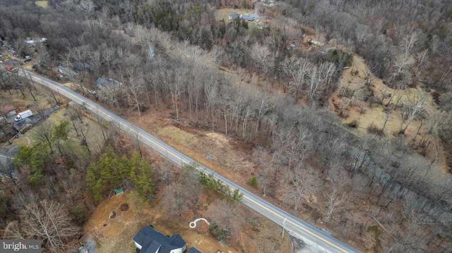 This tree-lined, 2.36 acre lot is the perfect site for your new home! Centrally located near I-81, in the fast-growing area of Bunker Hill, just 10 minutes from the VA border.    A 3 bedroom septic is already installed, making it easier for you to start building your dream home!