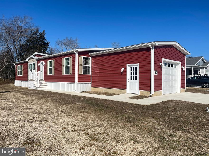 Beautiful Brand New 3BR Home in 55+ Sussex West. Contemporary style and built on energy efficiency and sustainability, our smarter beach homes focus on open floor plans, large windows, charming details and high-end finishes. Find luxury vinyl plank throughout, spacious living/dining/kitchen areas, gourmet kitchens with islands, beautiful stainless-steel appliances featuring natural gas cooking to keep the chef happy. Other features include pendant lights and recessed lighting, deep sinks, sparkling backsplashes, and generous primary bedrooms with huge walk-in closets and ensuite baths. Utilize the two additional guest rooms as your home gym, office or crafting space. Additional full bath and handy laundry/mud room complete the floor plan. These homes have a one car garage and off-street parking for two cars. Explore Sussex West, an active adult community with mature trees and amenities that include a beautiful clubhouse, heated indoor pool, dog park, pickle ball and shuffleboard (coming in 2025), bocce ball court and a horseshoe pit. Snow removal and recycling are included with your land lease, and you will enjoy community sponsored events and an onsite management team. Live a short drive to tax-free outlets, unique shops, world-class restaurants, and only five miles from the shops on Lewes’ Second Street. Perfect as your summer getaway or as your year-round residence, live your life in Sussex West, and live close to all that life in Delaware has to offer.

Our Land Lease Amenity Package Includes:
Clubhouse
Weekly Activities & Monthly Events
Indoor Salt-Water Swimming Pool w/Chair Lift & Shower Facility
Neighborhood Newsletter
Dog Park
Bocce Ball Court
Horseshoe Pit
Lewes to Georgetown Trail Access
Off Street Parking
Pets (2) Welcome
RV Storage (Fee)
Covered Mailboxes
Street Lights
Snow Removal
Clubhouse Rental
On-Site Management & Maintenance
On-site Sales Office with Home Listing Service
State-of-the-Art Security Camera System
Pickleball & Shuffleboard – Coming This Year