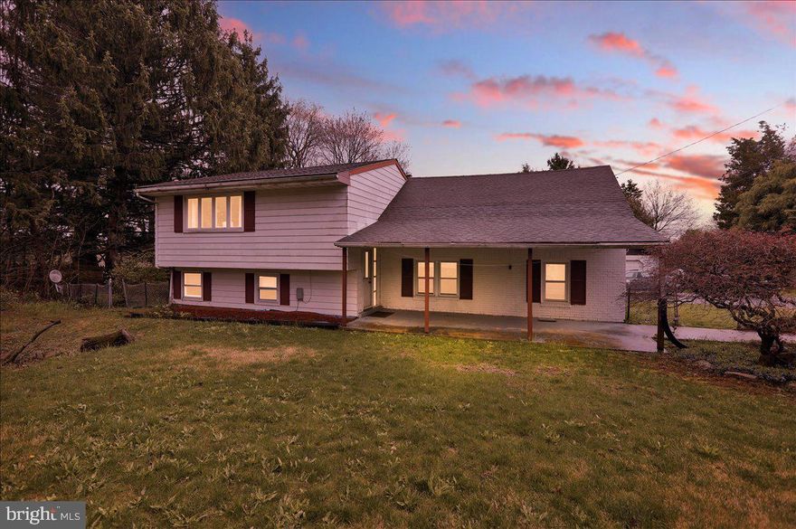 Quiet country living at its finest!  Situated on a large spacious property, this unique split level home boasts roughly 2400 sq/ft of above grade finished square footage. The front of the home offers a large covered front porch perfect for enjoying a morning cup of coffee, through the front door and entry way you will enter into a large kitchen complete with newer stainless steel appliances and laminate hardwoods throughout. Off of the kitchen you will find an updated full bath and secondary bedroom with original hardwood flooring. Additionally, off the kitchen you will notice the home's split level staircase. The lower level offers a full finished walkout basement equipped with a large living area, laundry room, and a large additional bedroom/bonus room. The Upper level offers a massive family room and access to an additional office space or small bedroom. The home's main bedroom and additional full bath is located in the back of the home with its own private stairwell, accessible just off the kitchen. Outside you will note the back deck overlooking the expansive backyard. The home also offers an oversized 1 car detached garage, detached carport, multiple parking spots, and a large storage shed. This property ris perfect whether it's to build a family with plenty of space to grow, or to just slow down and enjoy some peace and quiet in a country location. Don't miss out on this unique property, schedule your showing today!