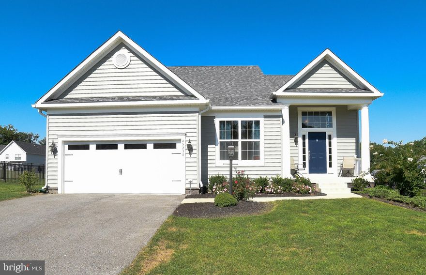 Don't wait to build when you can move right into this amazing home.  As you enter the foyer there is a den/office and a formal dining room w/crown molding & wood floors.   The foyer continues back to the open concept living area which includes an upgraded kitchen with granite counters, stainless appliances, tile floors, tile backsplash, pendant lighting,  & bar style seating.   There is a door in the kitchen/great room area  which open to the deck and fenced back yard great for entertaining and relaxing.  The great room has vaulted ceilings, a gas fireplace and wood floors.  The first floor primary bedroom is spacious and includes vaulted ceilings and a walk in closet.  The primary bathroom has a corner soaking tub, separate tile shower,  dual sinks and tile flooring.   Main level laundry and access to the 2 car garage.  The stairs lead to the second story which has an open loft area looking over into the great room.  This space can be used for a variety of things including additional living space, office space, computer/gaming space etc.  There are two bedrooms on this level and a full bathroom.  The basement has a rec room with multiple living areas,  a rough in for a wet bar/kitchen, a full bathroom and a bedroom.  Additional storage room located in basement.   Lots of potential with the basement space for an in law suite.  Close to local shopping, markets, and schools.  Easy access to Calvert County and commute to PAX River Naval Base.  Scheduling your showing today!