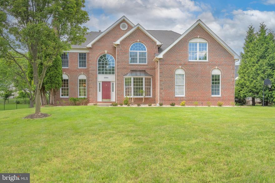 Elegant and Spacious Colonial-Style Home in Quince Orchard Knolls
Welcome to this expansive brick-front colonial home, freshly painted and nestled on a generous half-acre lot in the serene Quince Orchard Knolls. Boasting an impressive 4,300 square feet of above-grade living space complemented by an additional 2,500 square feet on the lower level, this property is one of the largest in the development, perfectly designed to balance private quarters and family areas, making it an ideal setting for hosting and daily living.
As you step into the grandeur of this home, a two-story foyer with a winding staircase welcomes you, setting the tone for the rest of the property. Immediately to your left, the home presents a formal living room featuring a cozy wood-burning fireplace and a separate dining room, both adorned with elegant crown and chair molding and rich wood flooring. These rooms are gracefully separated by stylish pillars, enhancing the traditional aesthetics of the home.
To the right of the foyer, there's a convenient front office, perfect for those who work from home. The heart of the home, the kitchen, lies just past the half bath and offers every modern amenity a homeowner could desire: extensive cabinetry, a central island with a cooktop, a double basin sink, tiled floors, and ample countertop space. Adjacent to the kitchen, the sunroom with a vaulted ceiling and patio access offers a tranquil spot for relaxation or casual dining.
Further enhancing the grand living space is a two-story family room, illuminated by natural light streaming through an expansive wall of windows, and features another wood-burning fireplace. This room, along with the rest of the home, can be accessed via two staircases, front and back, each leading to a landing place overlooking the main level.
The upstairs is just as impressive, starting with a luxurious primary suite that includes a tray ceiling with a ceiling fan, a cozy sitting area with built-in shelving, three walk-in closets, and an opulent ensuite bathroom equipped with dual vanities, a soaking tub, a separate shower, and a private toilet area. The second bedroom features ample space, a walk-in closet, and a full bath. Two additional bedrooms share a full Jack and Jill bathroom, and another bedroom suite is conveniently located on the main level, complete with a full bath and walk-in closet.
This property is a true gem, offering nearly 6,800 square feet of versatile living space, equipped with zoned HVAC (the main HVAC is brand new), two fireplaces, five bedrooms, five full bathrooms, a half bath, and a two-car garage, making it a perfect blend of luxury, comfort, and convenience.